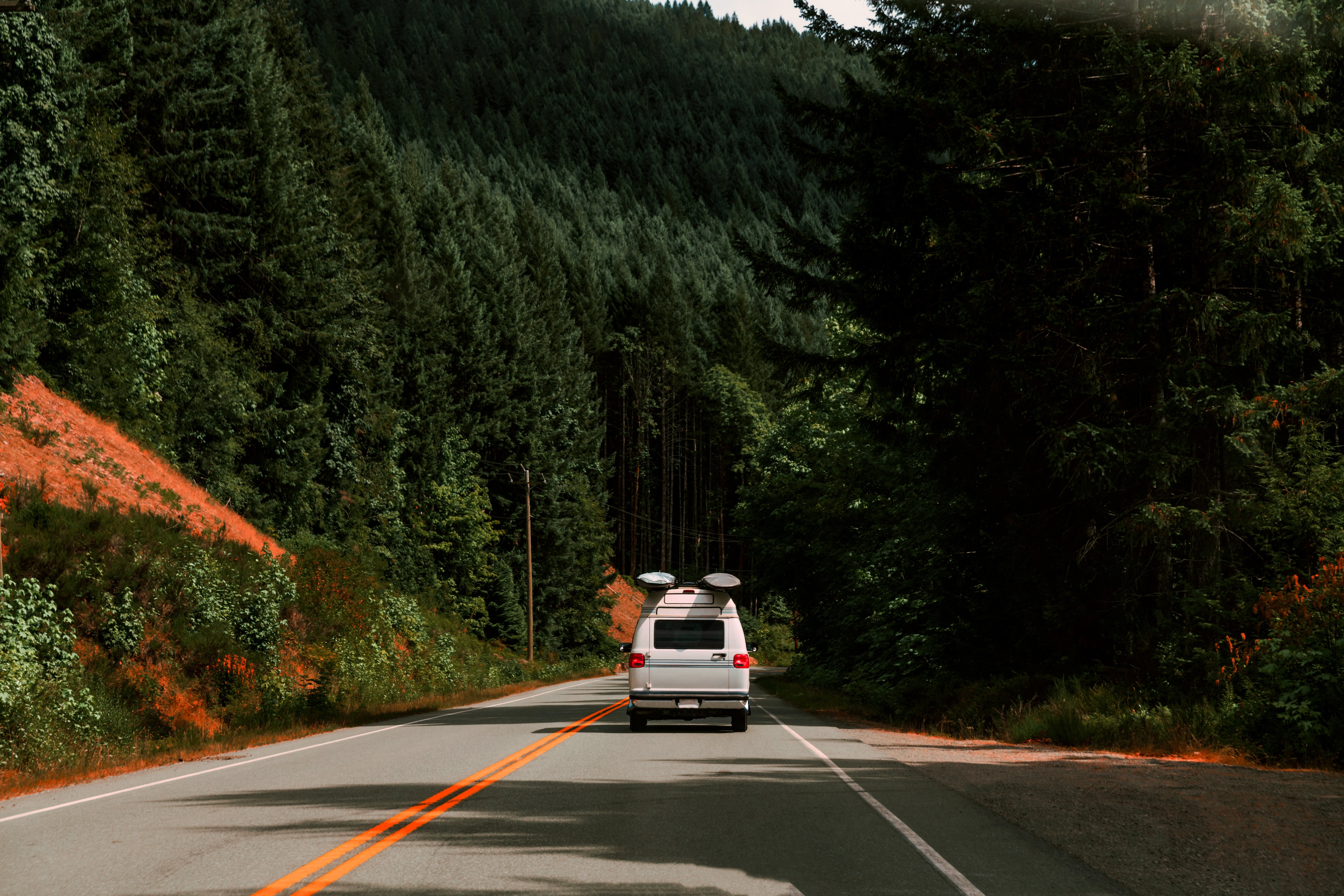 Stunning Photo: Van Driving Through Majestic Mountains