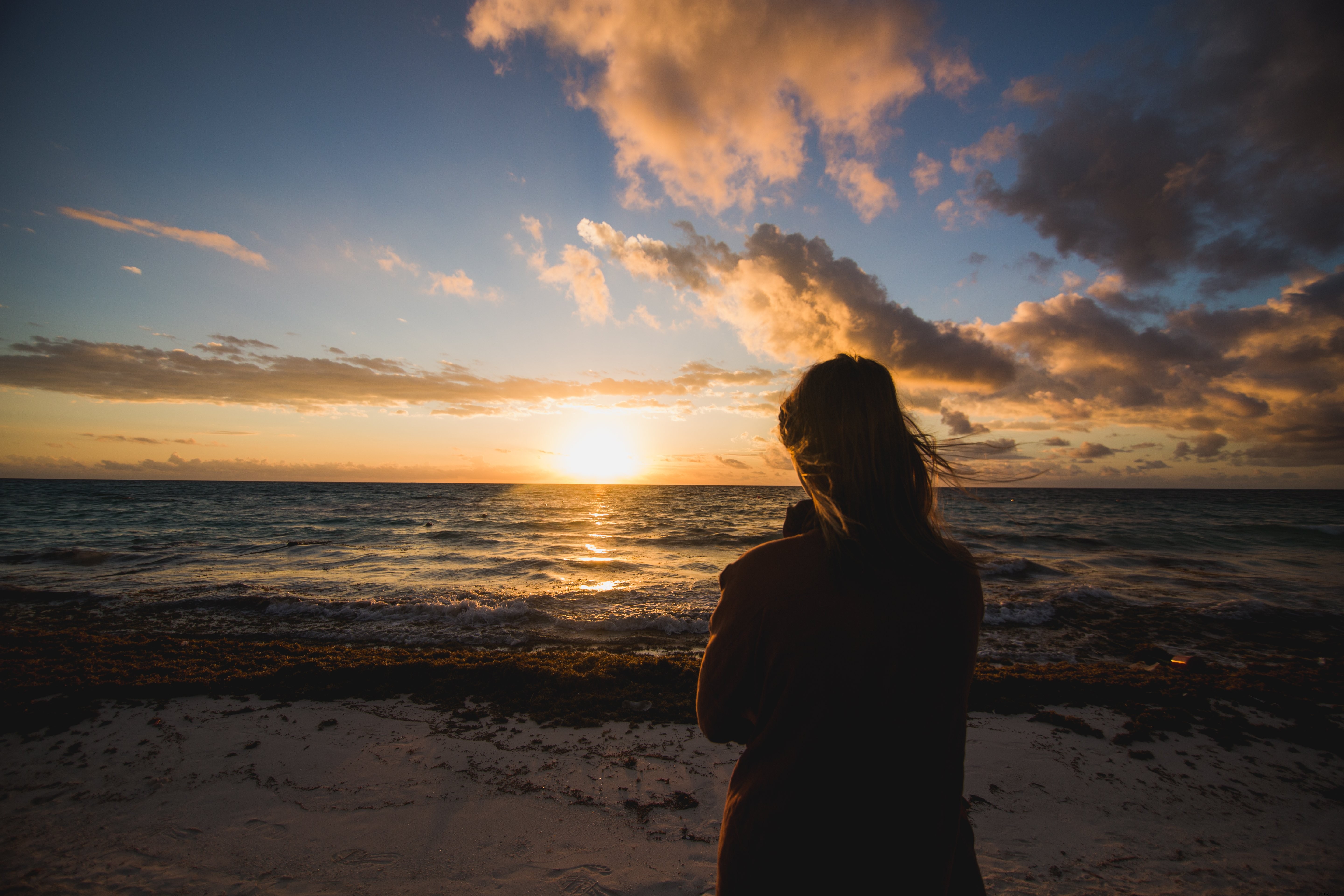 Stunning Photo: Serene Woman Watching Beach Sunrise