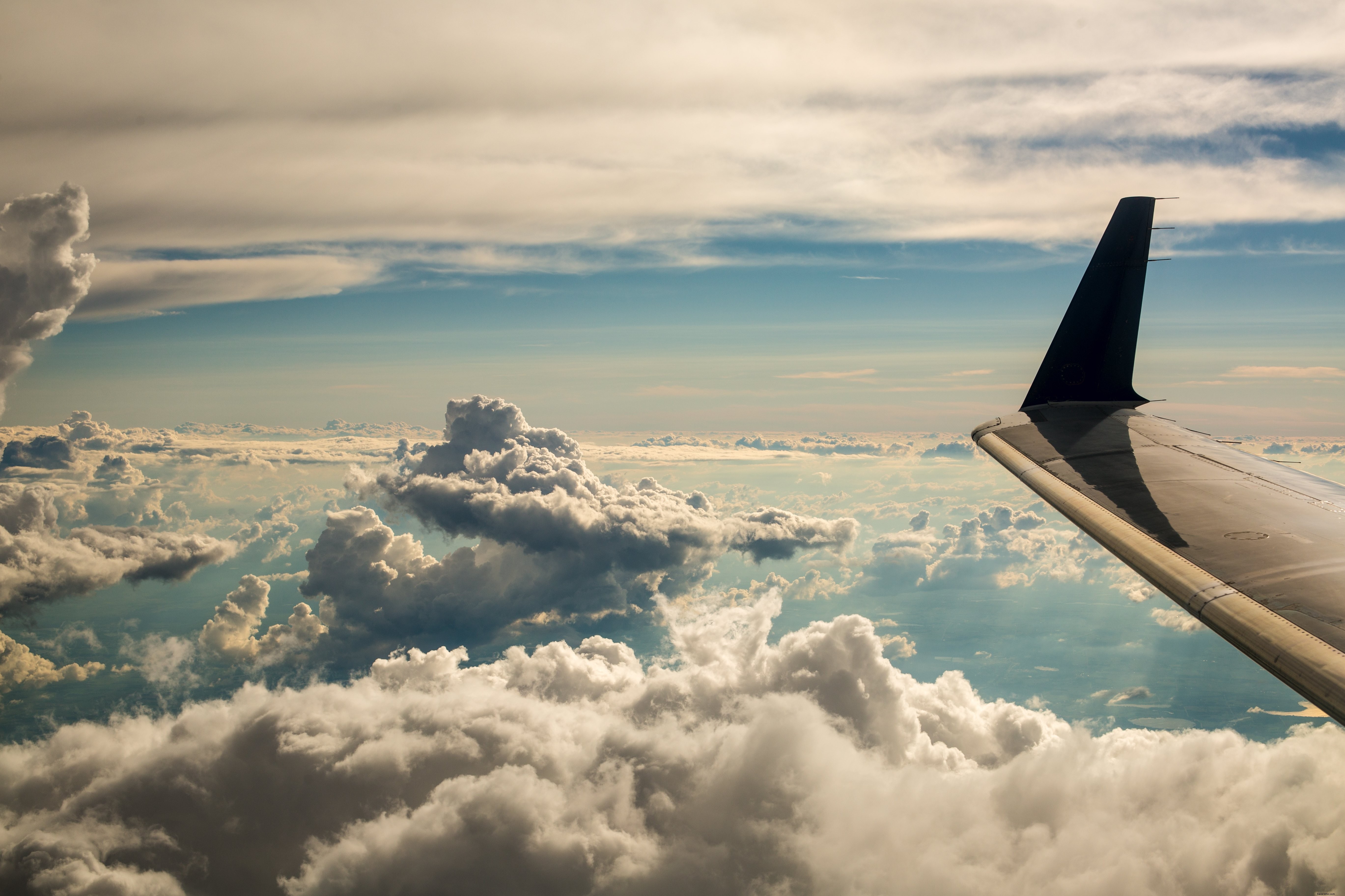 Breathtaking Clouds from Airplane Window: Stunning Aerial Photograph