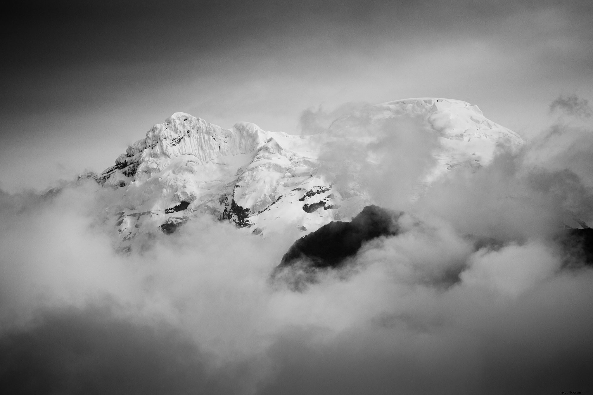 Stunning Snow-Capped Peaks Piercing the Clouds – Breathtaking Photo
