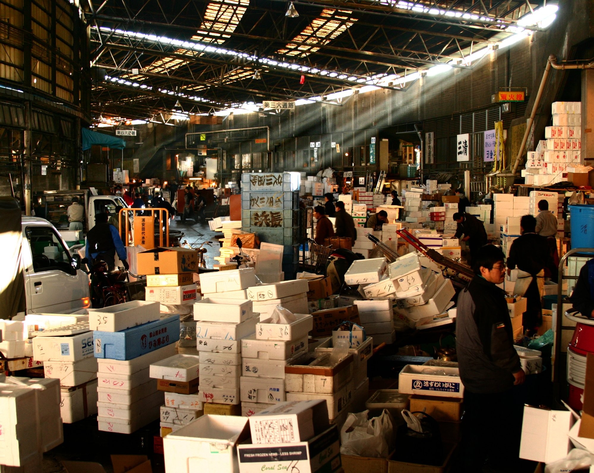 Captivating Photo: Towering Box Piles in a Bustling Japanese Market