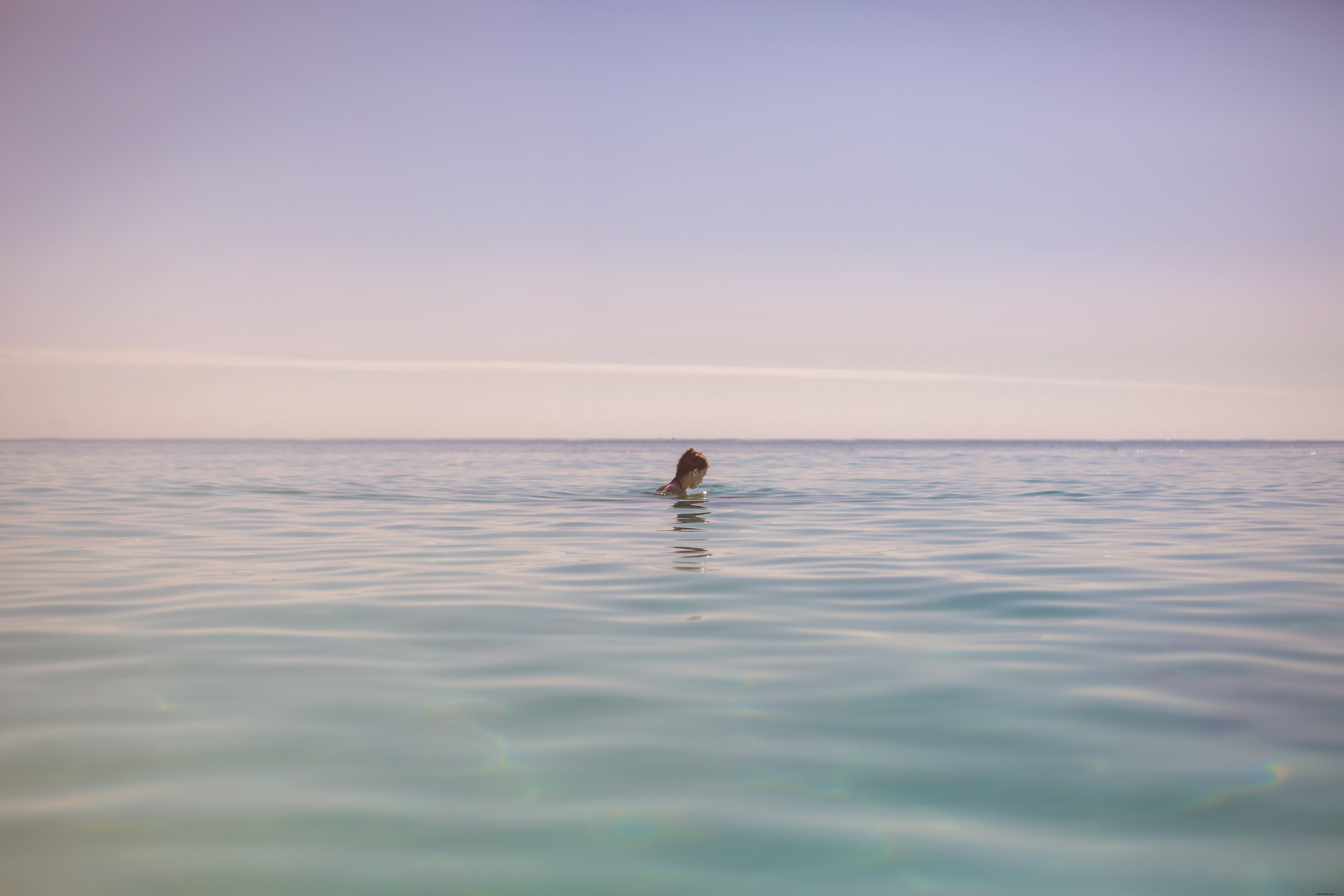 Stunning Photo of Girl Splashing in Crystal Beach Waters