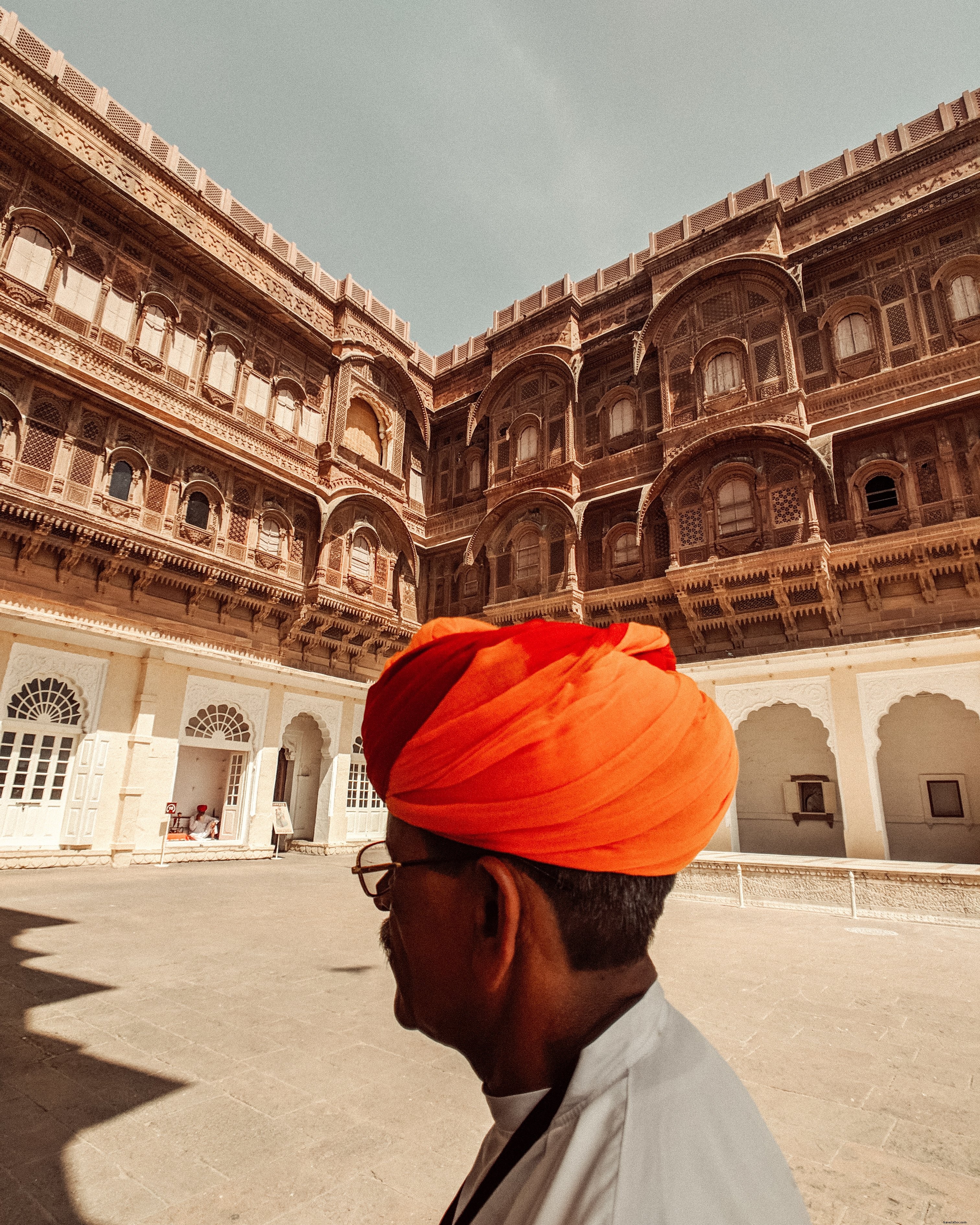 Captivating Photo: Man Strolling Through Serene Courtyard