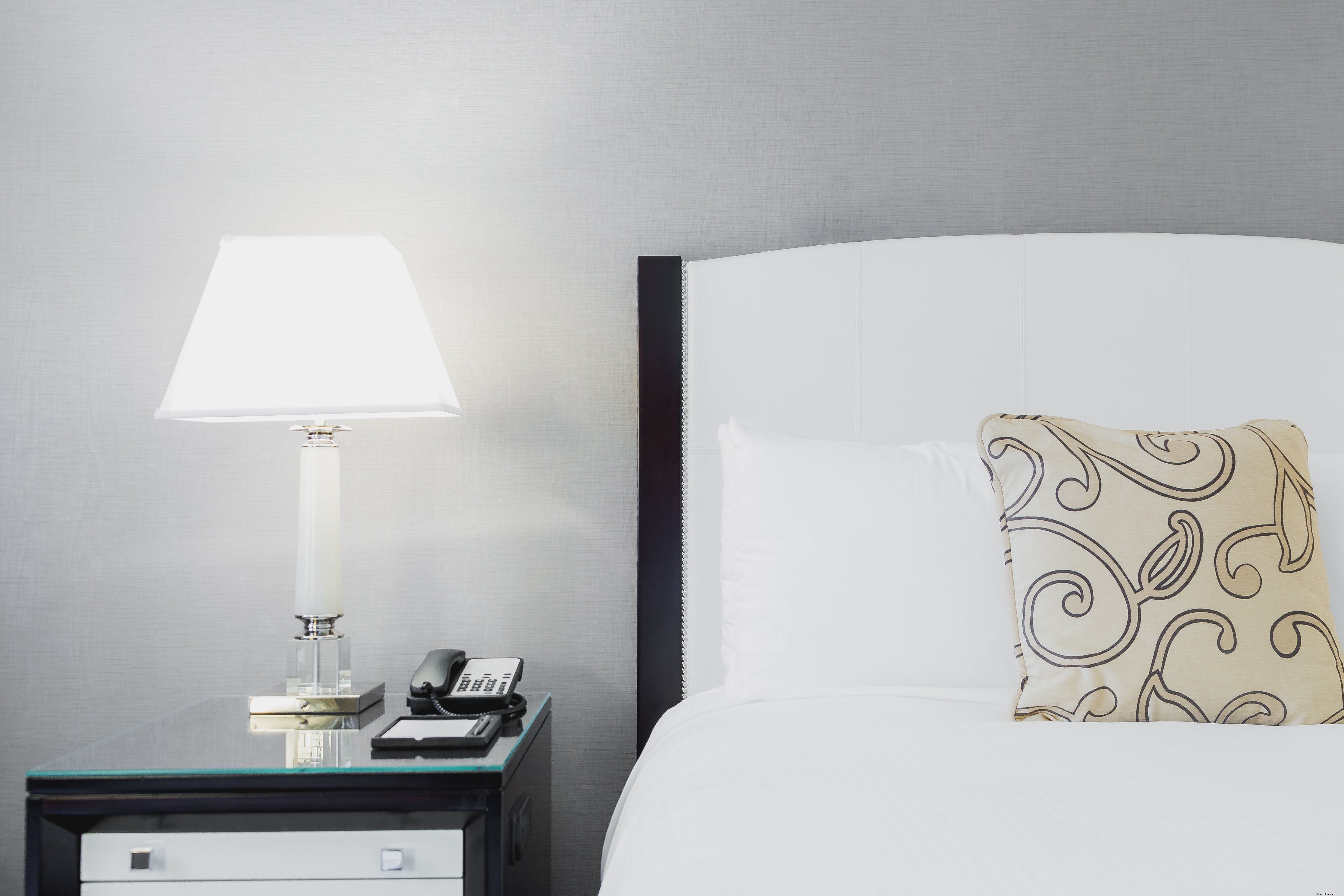 Elegant Hotel Bed and Nightstand Interior Photo