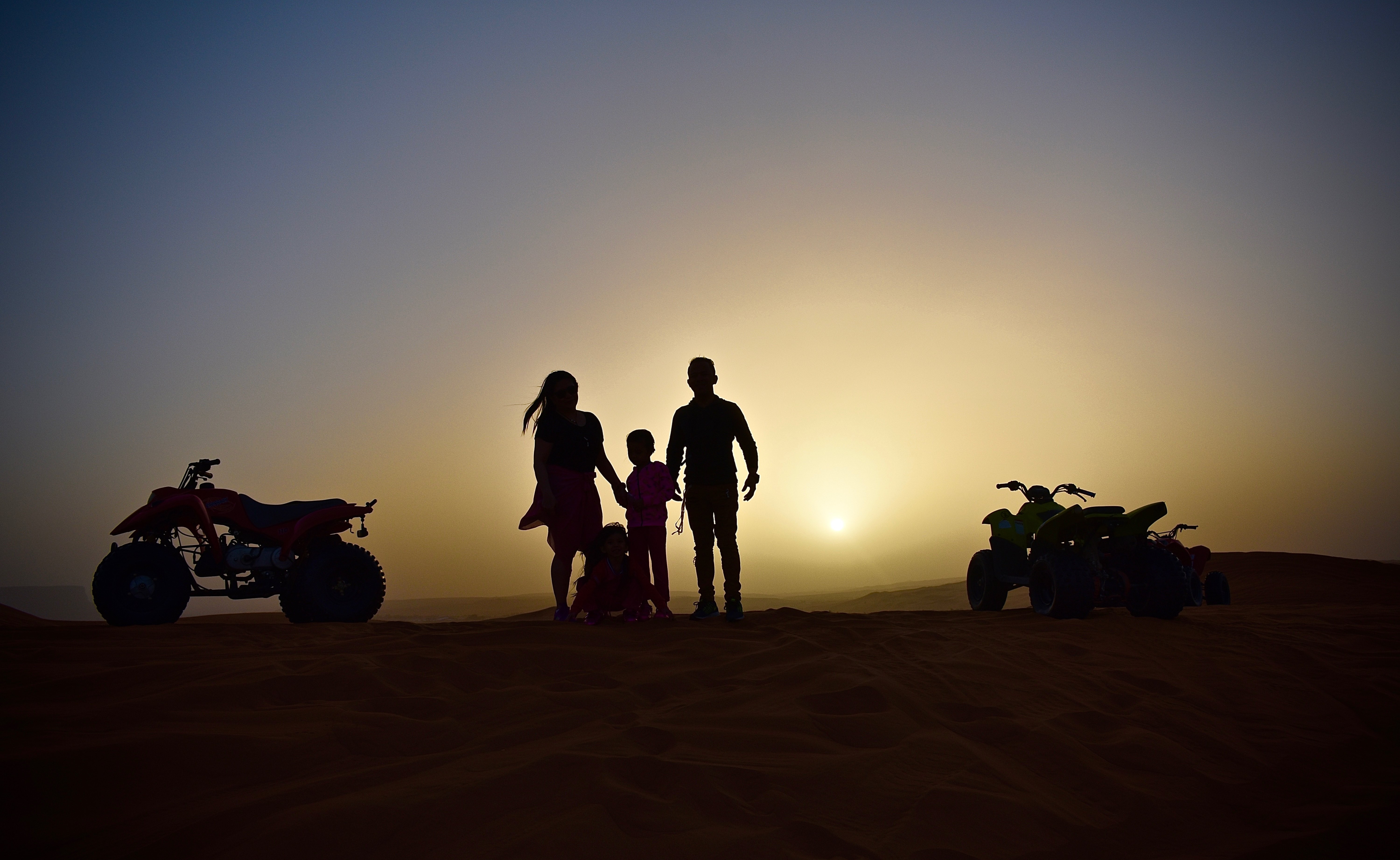 Thrilling Family Quad Bike Adventure at Sunset – Stunning Photo