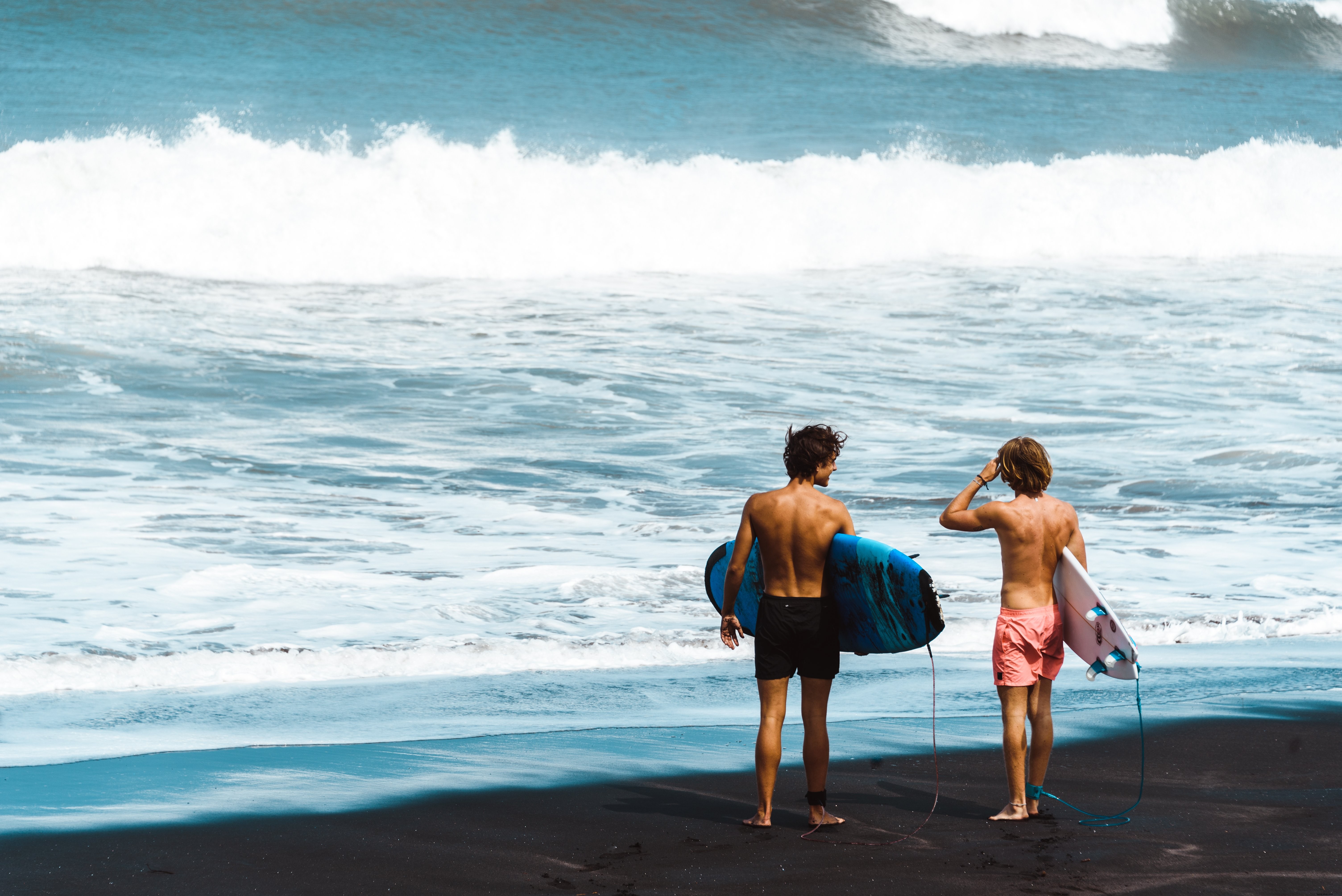 Stunning Photo of Surfers Standing on the Shore