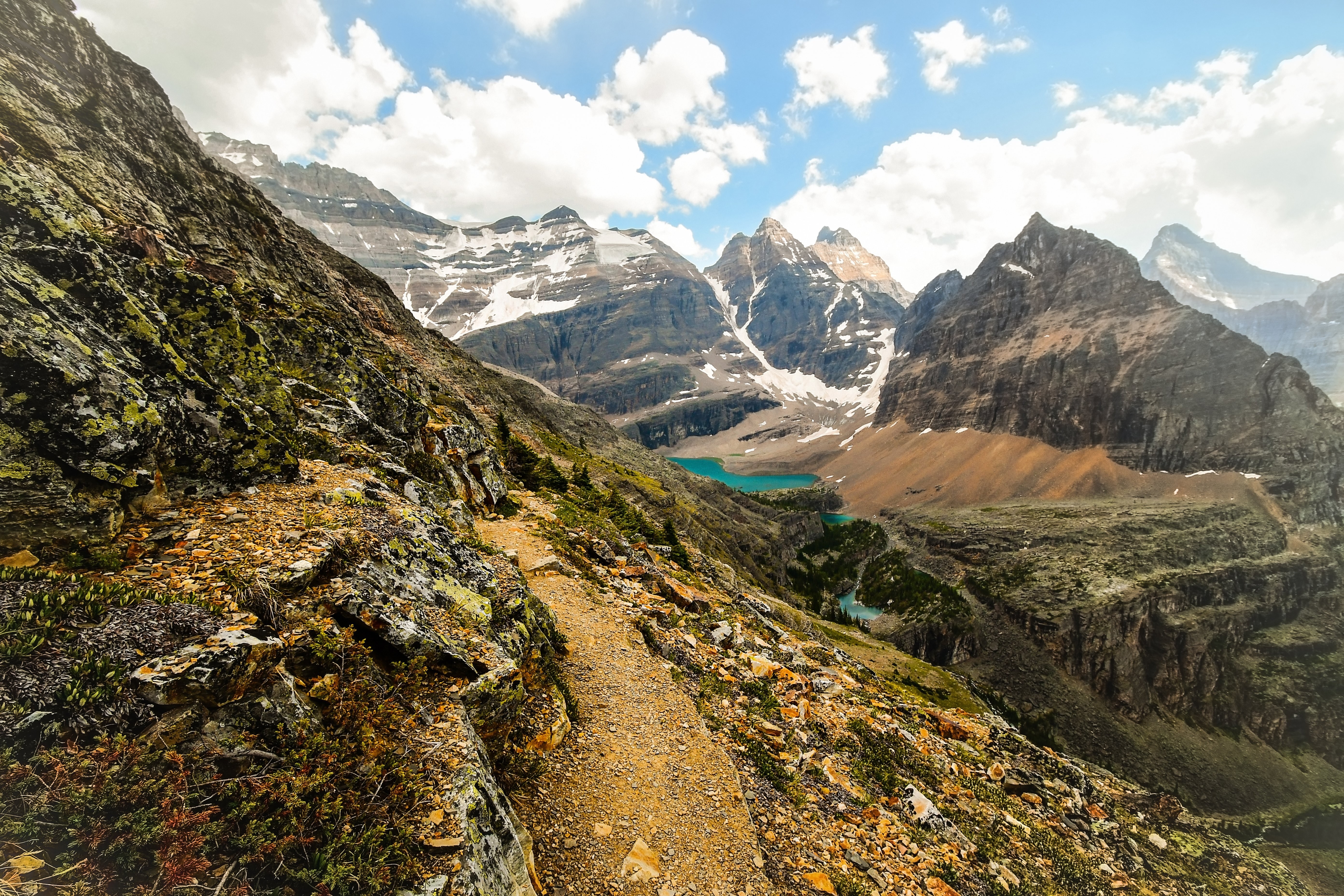 Breathtaking Rocky Mountain Path to a Serene Valley Lake