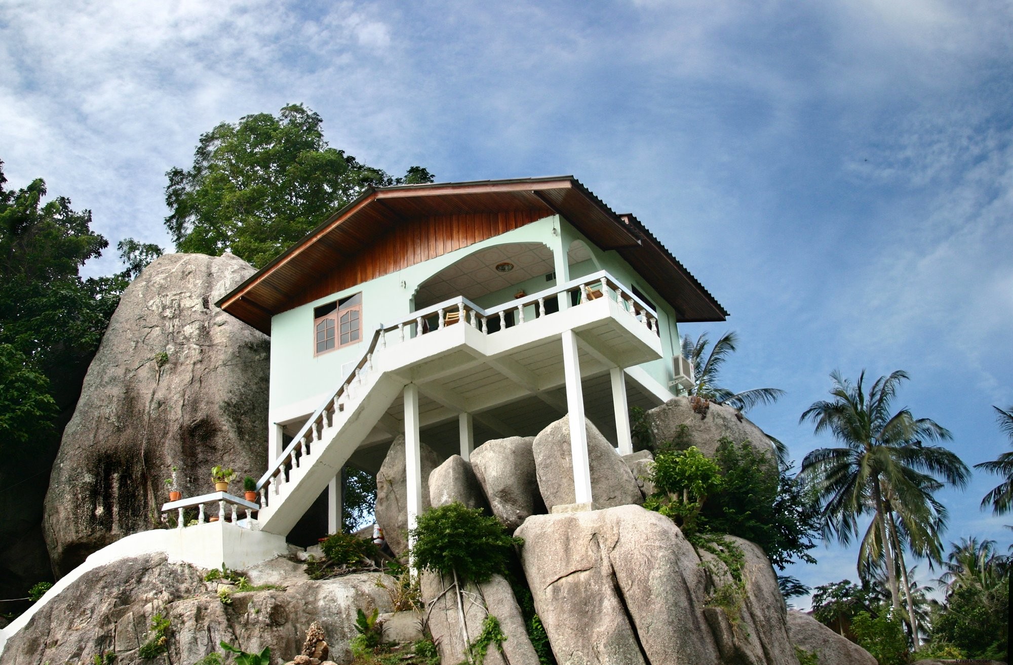 Stunning Photo: Luxurious House Perched on Tropical Rock Formation