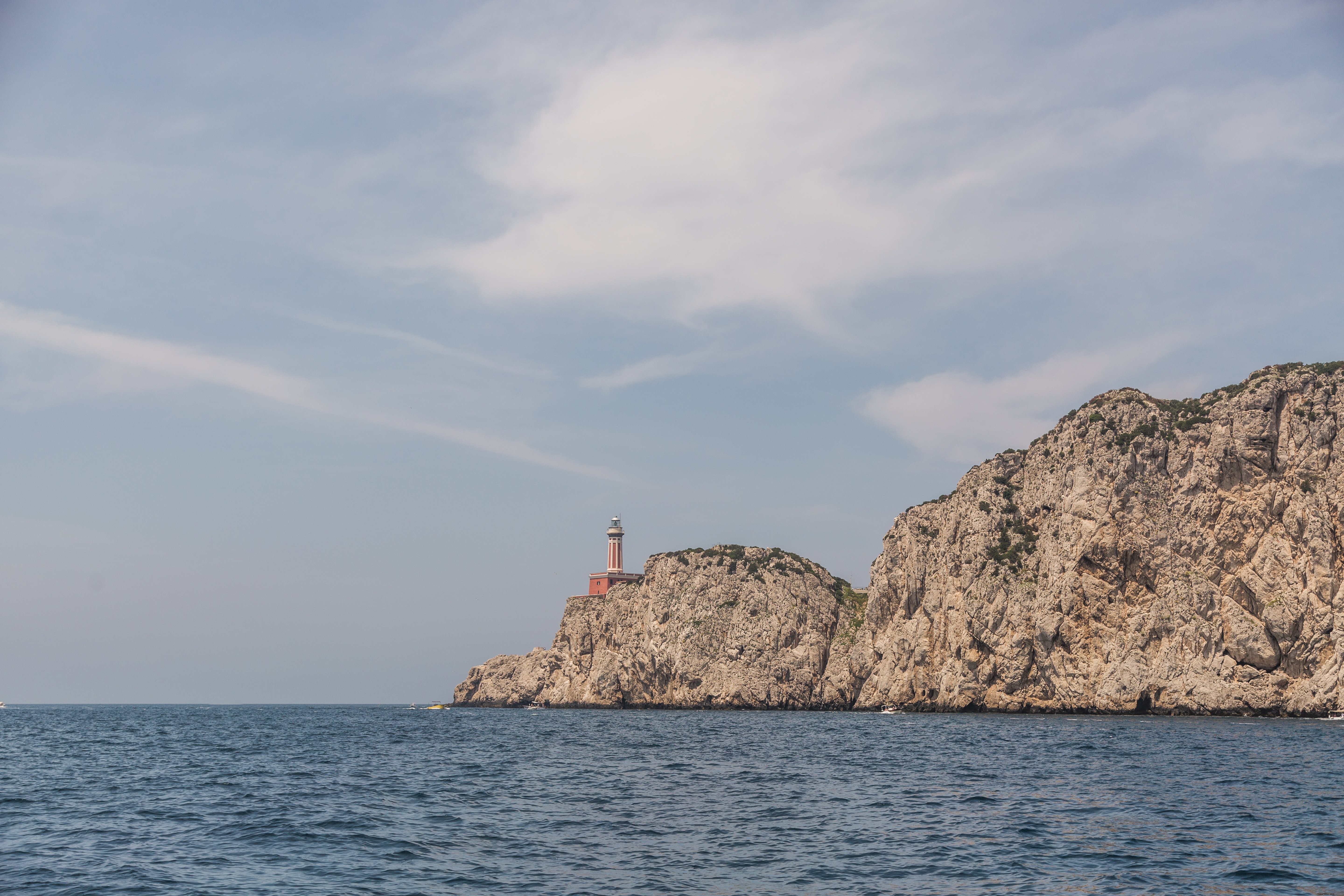 Stunning Lighthouse on Dramatic Rocky Cliff in Italy – Captivating Photo