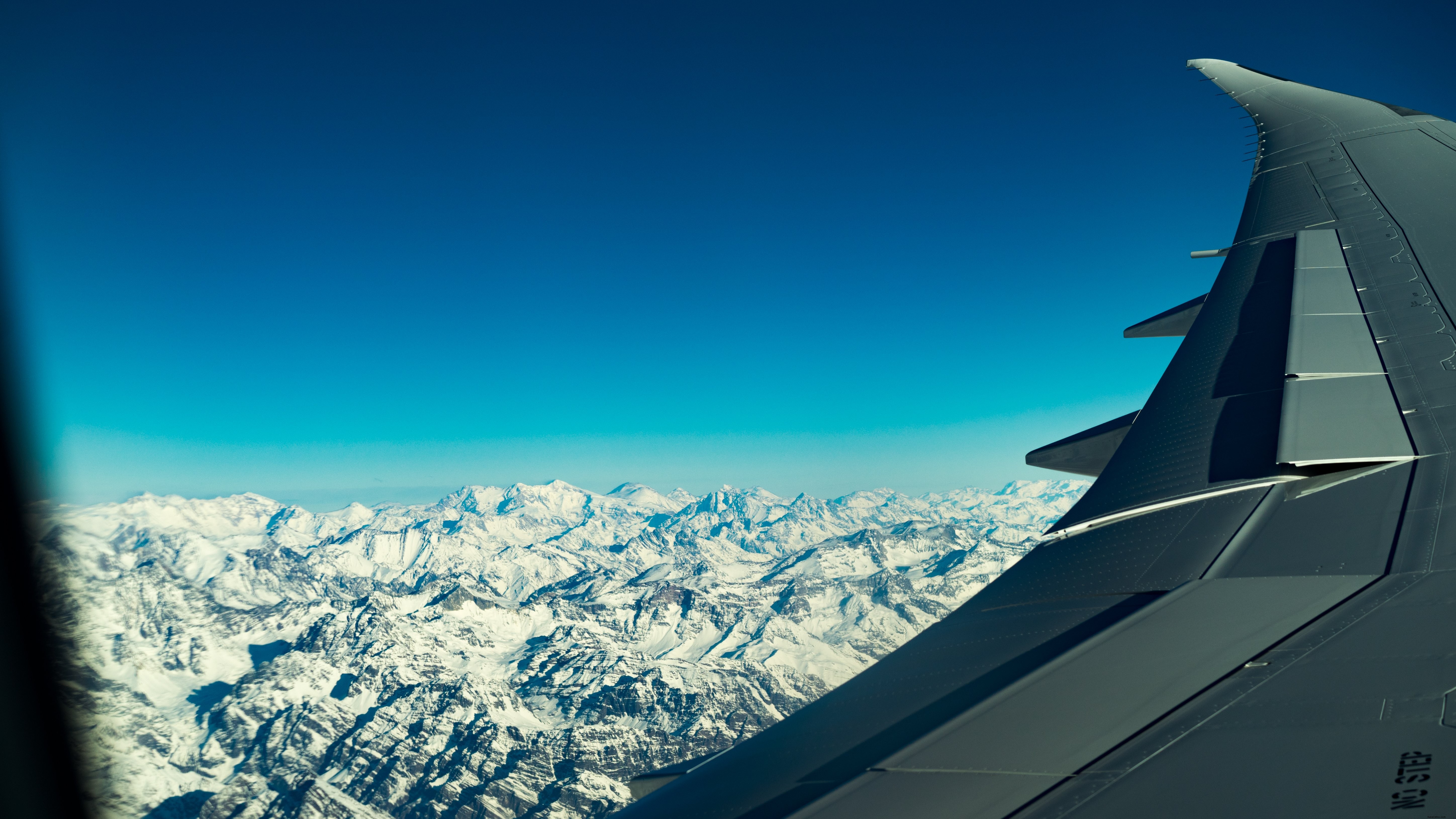 Stunning Aerial View: Flight Over Majestic Mountains