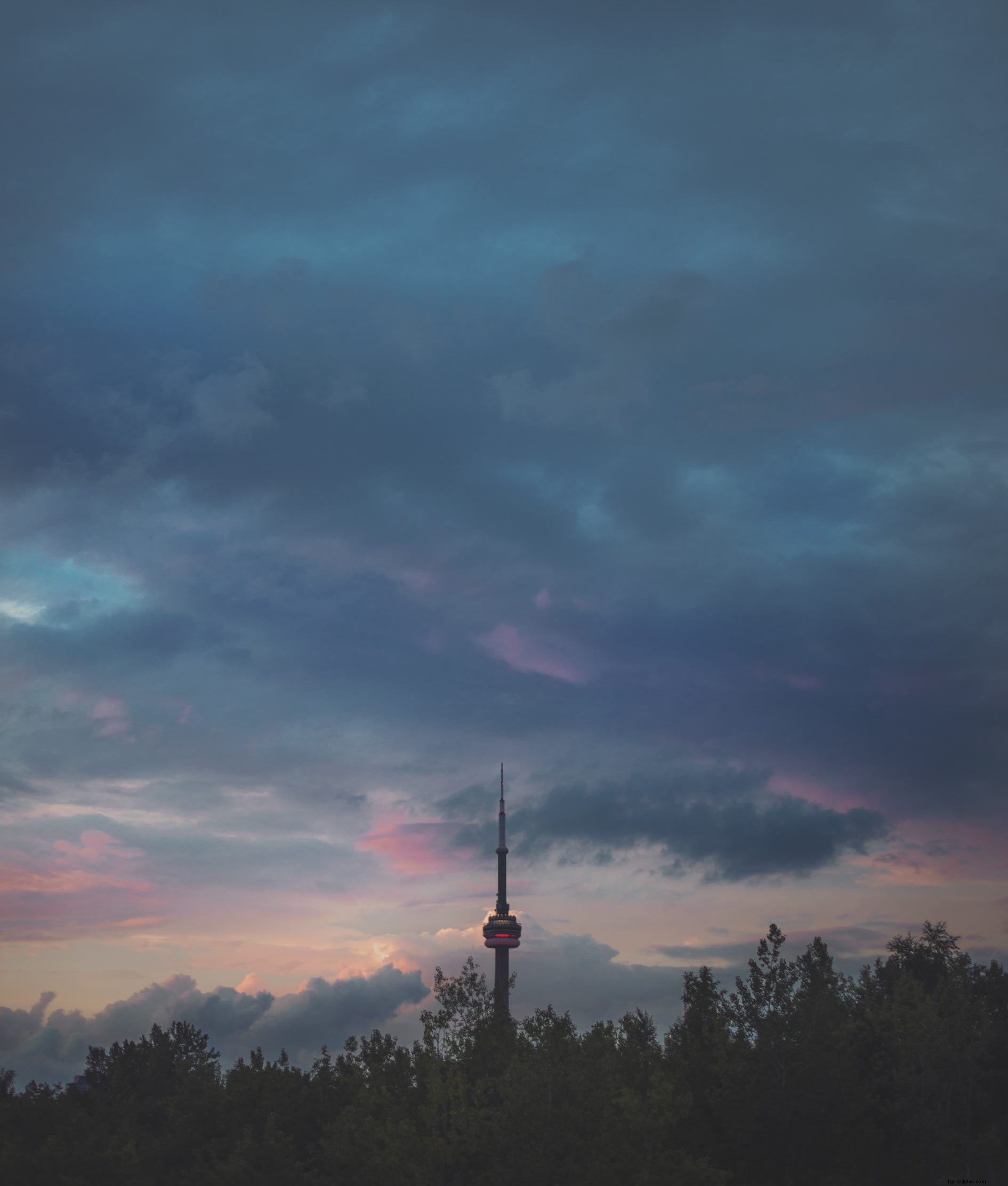 Stunning CN Tower Sunset Photo with Dramatic Cloudy Skies