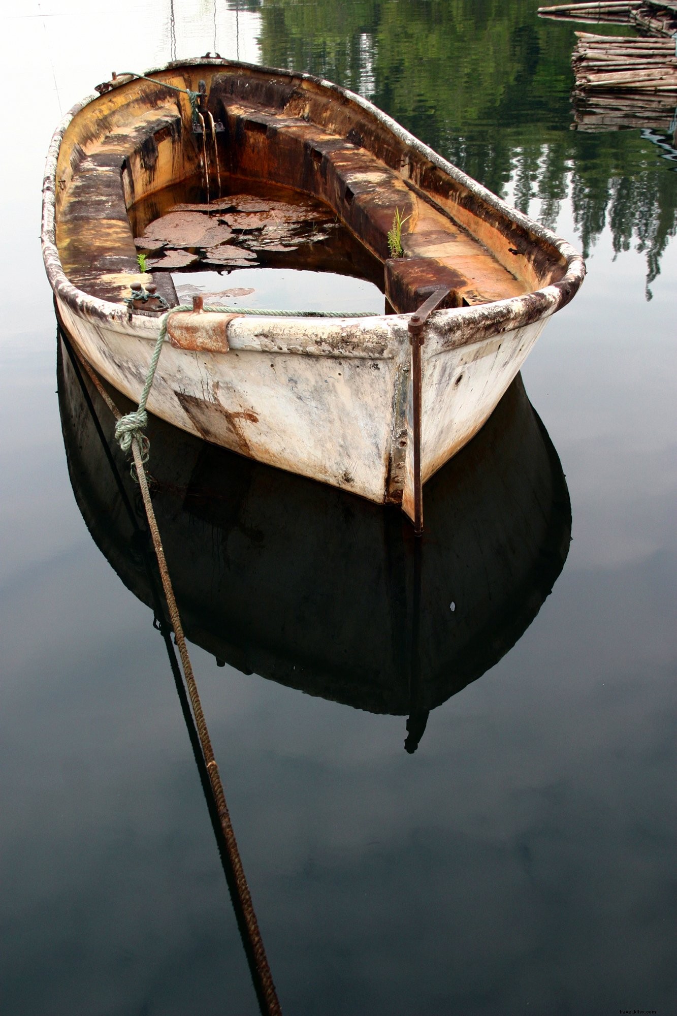 Stunning Rusted River Boat on Crystal Clear Waters - High-Resolution Photo