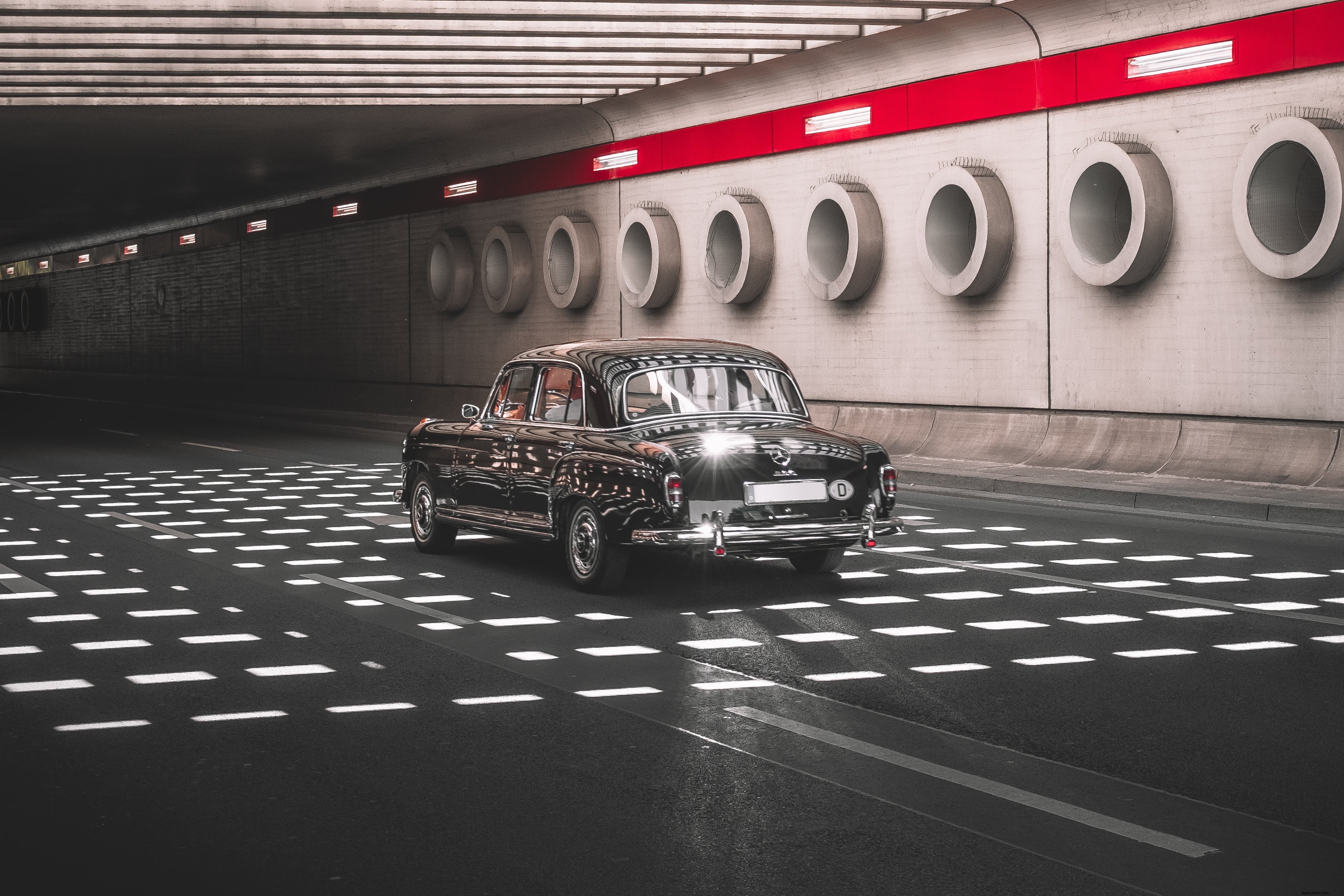 Stunning Vintage Car Cruising Through Dramatic Underpass – Captivating Photo