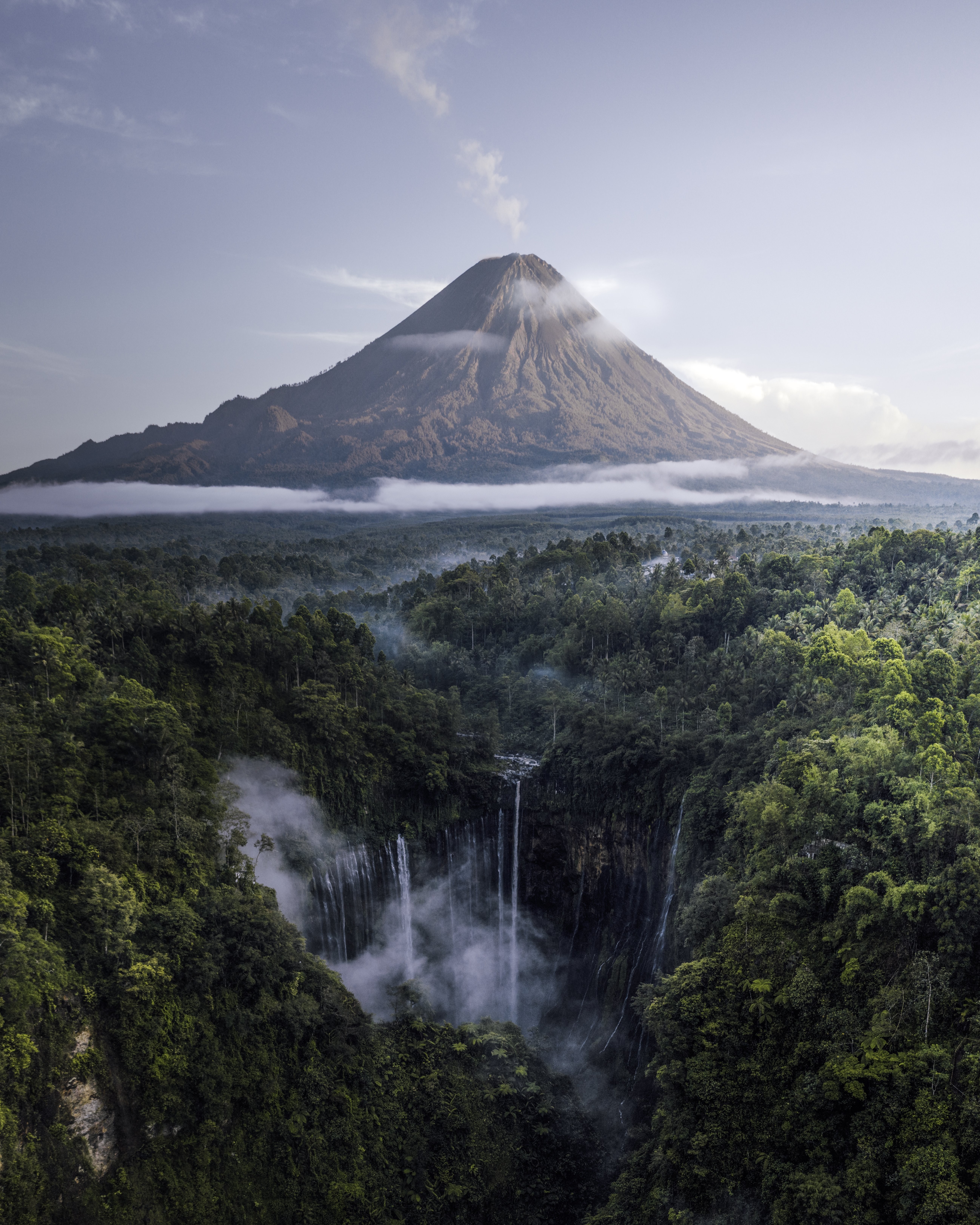Stunning Jungle Waterfalls with Smoking Volcano in the Distance – Breathtaking Photo