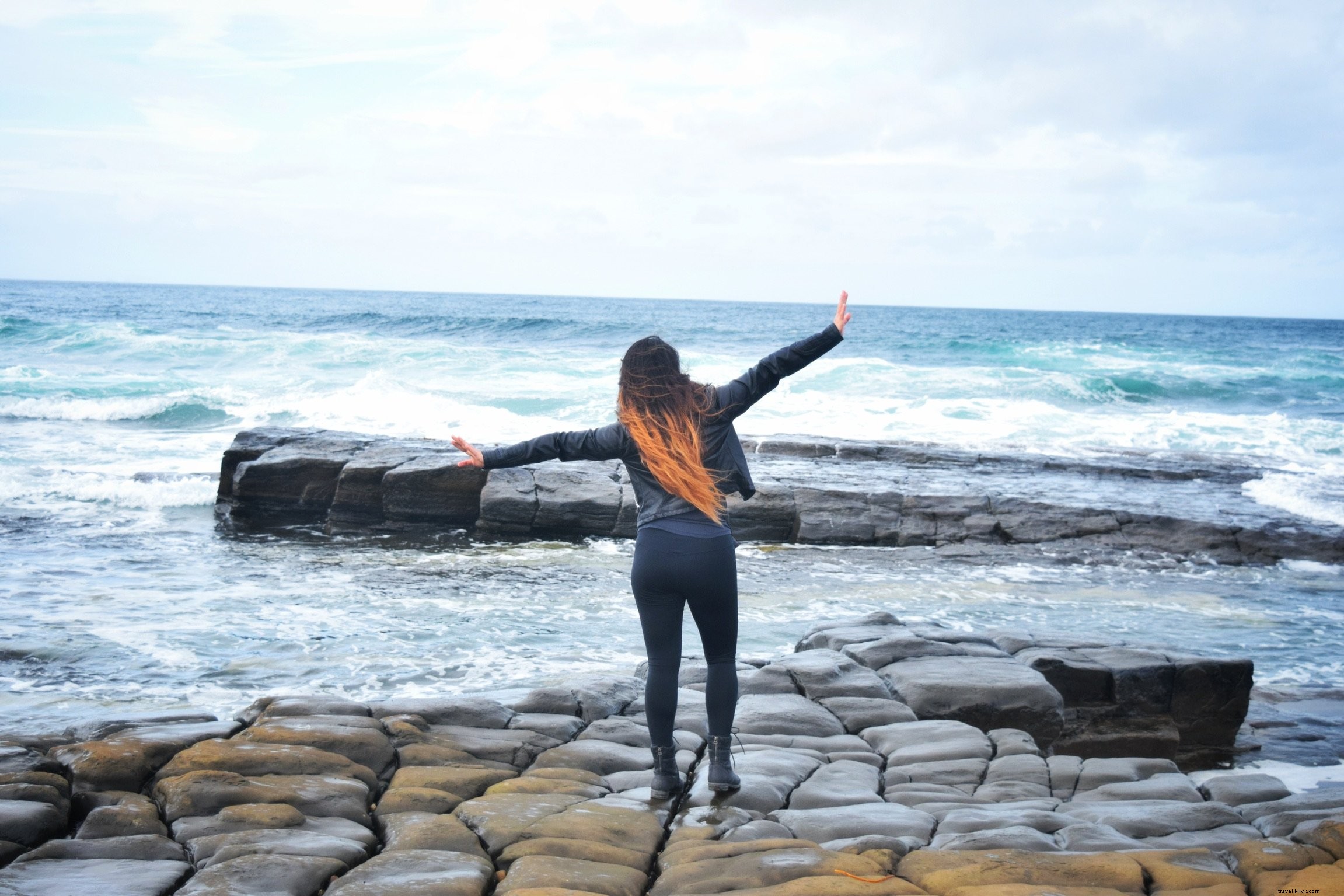 Stunning Photo: Woman with Open Arms by the Ocean