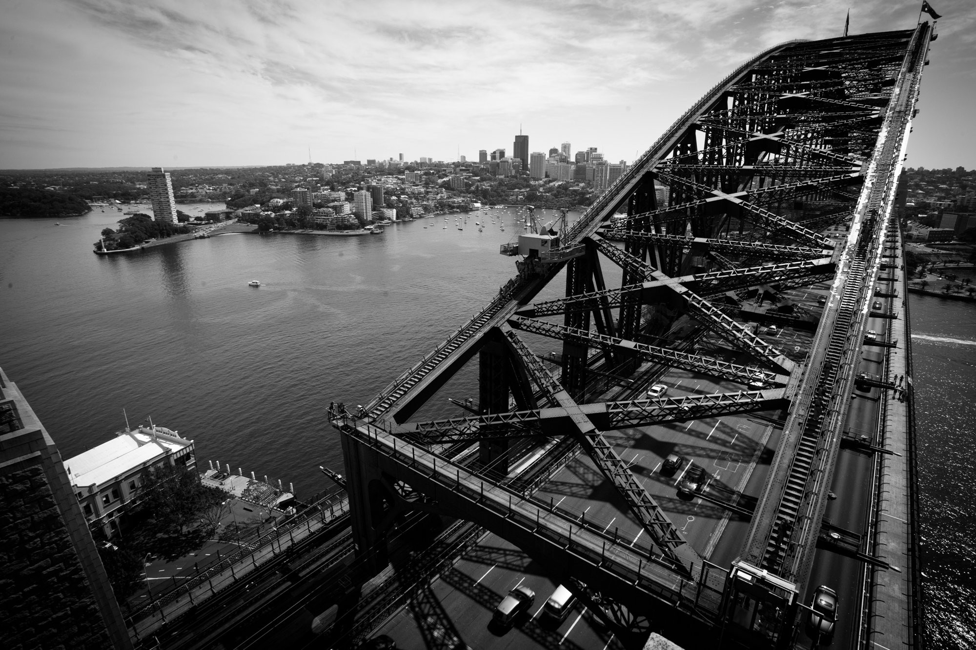 Stunning Black & White Photo of Iconic Bridge Over City Skyline