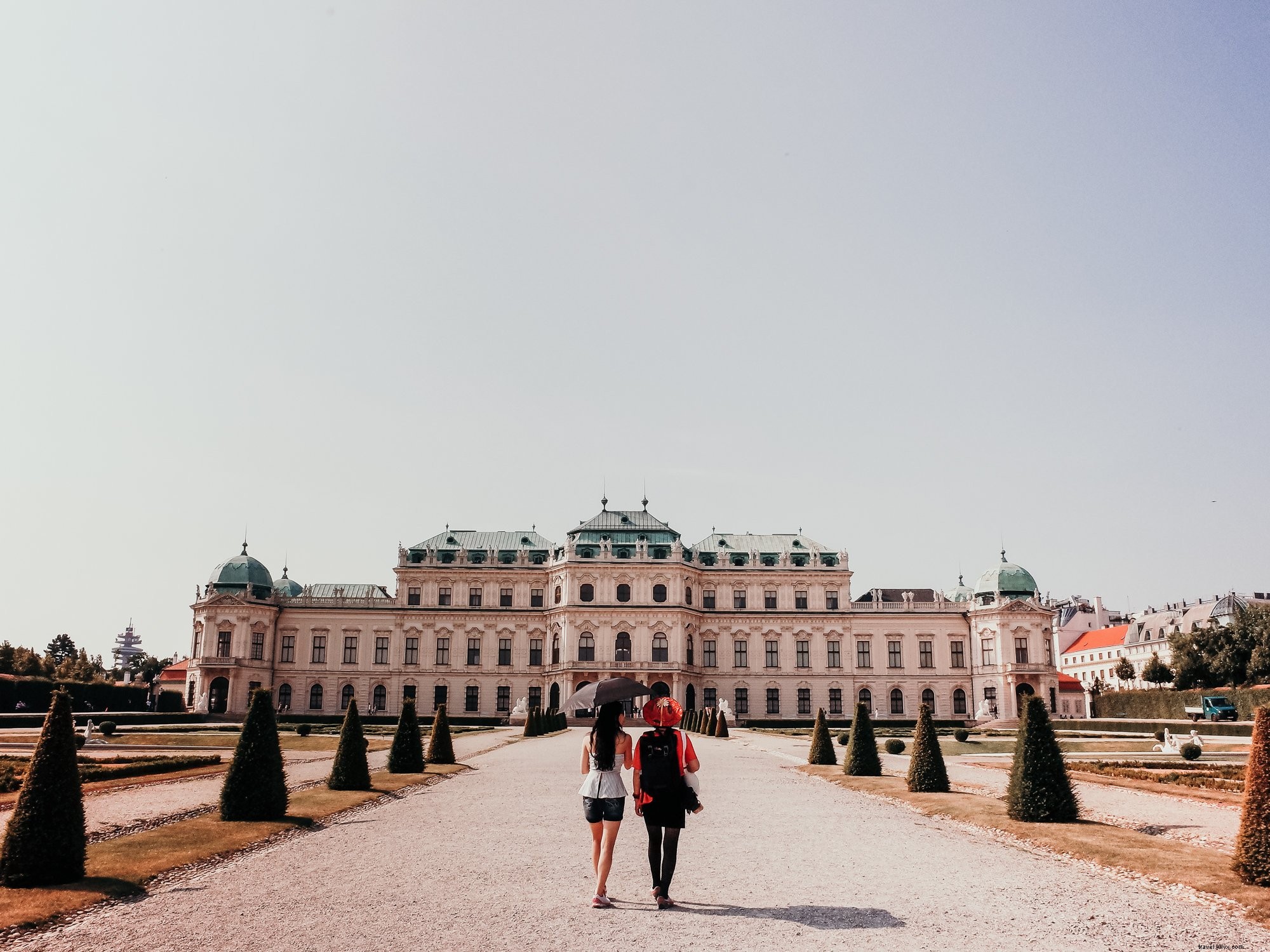 Captivating Photo: Two People Approaching a Grand White Building