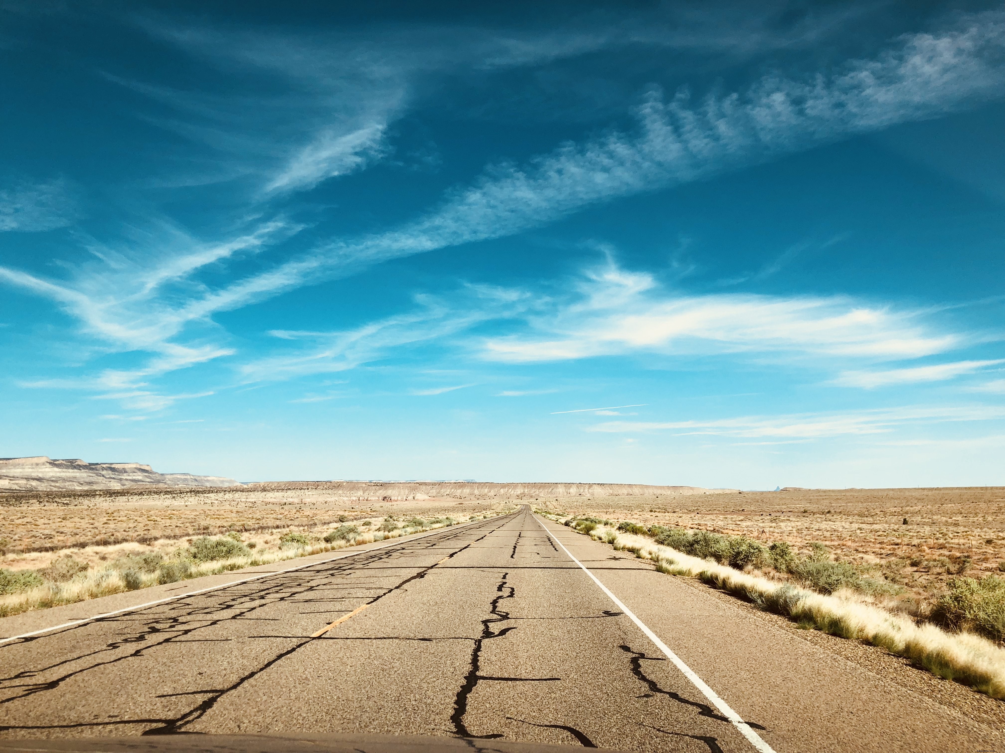 Stunning Desert Highway Under Vibrant Blue Sky – Captivating Photo