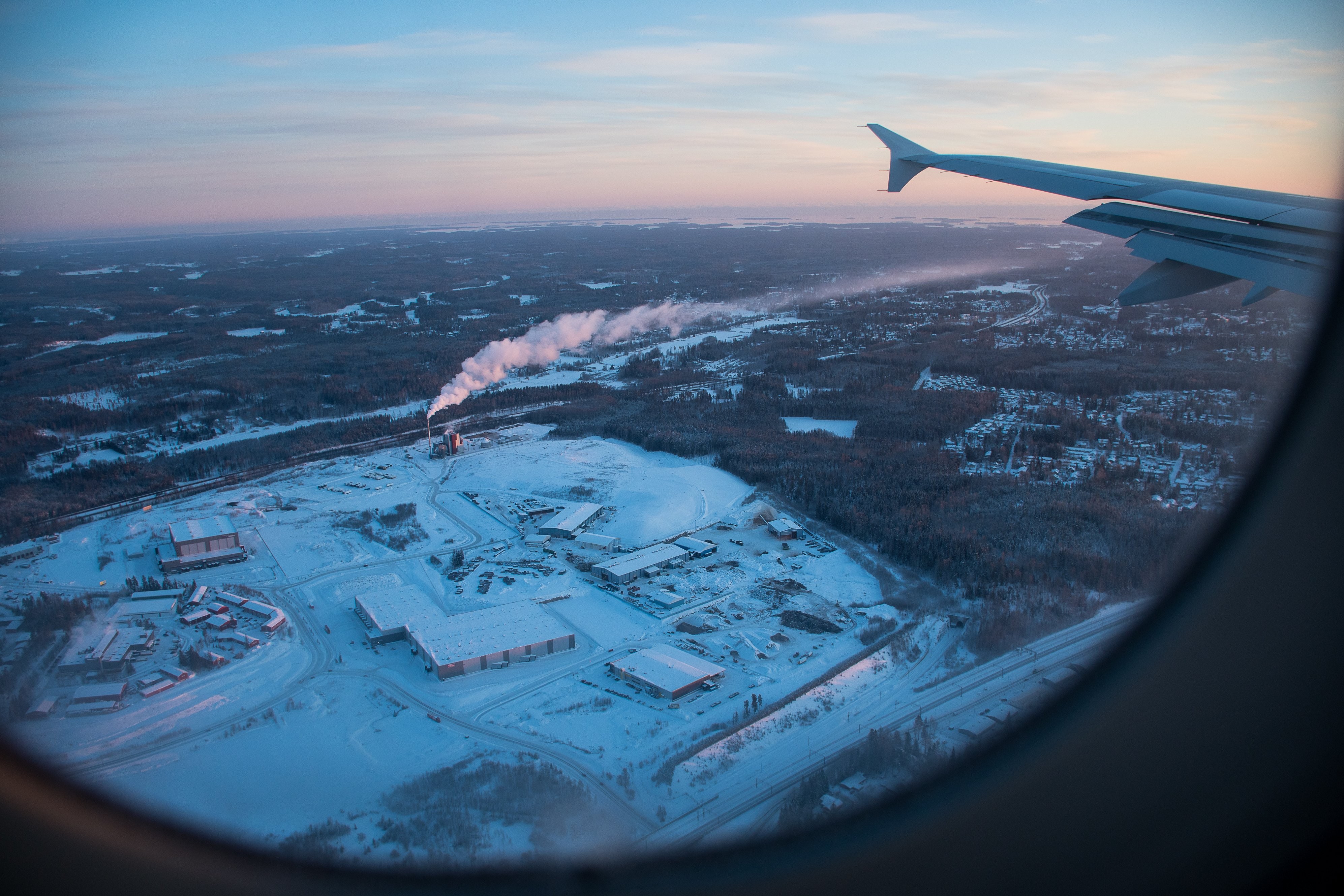 Stunning Winter Landscape from Airplane Window | Captivating Aerial Photo
