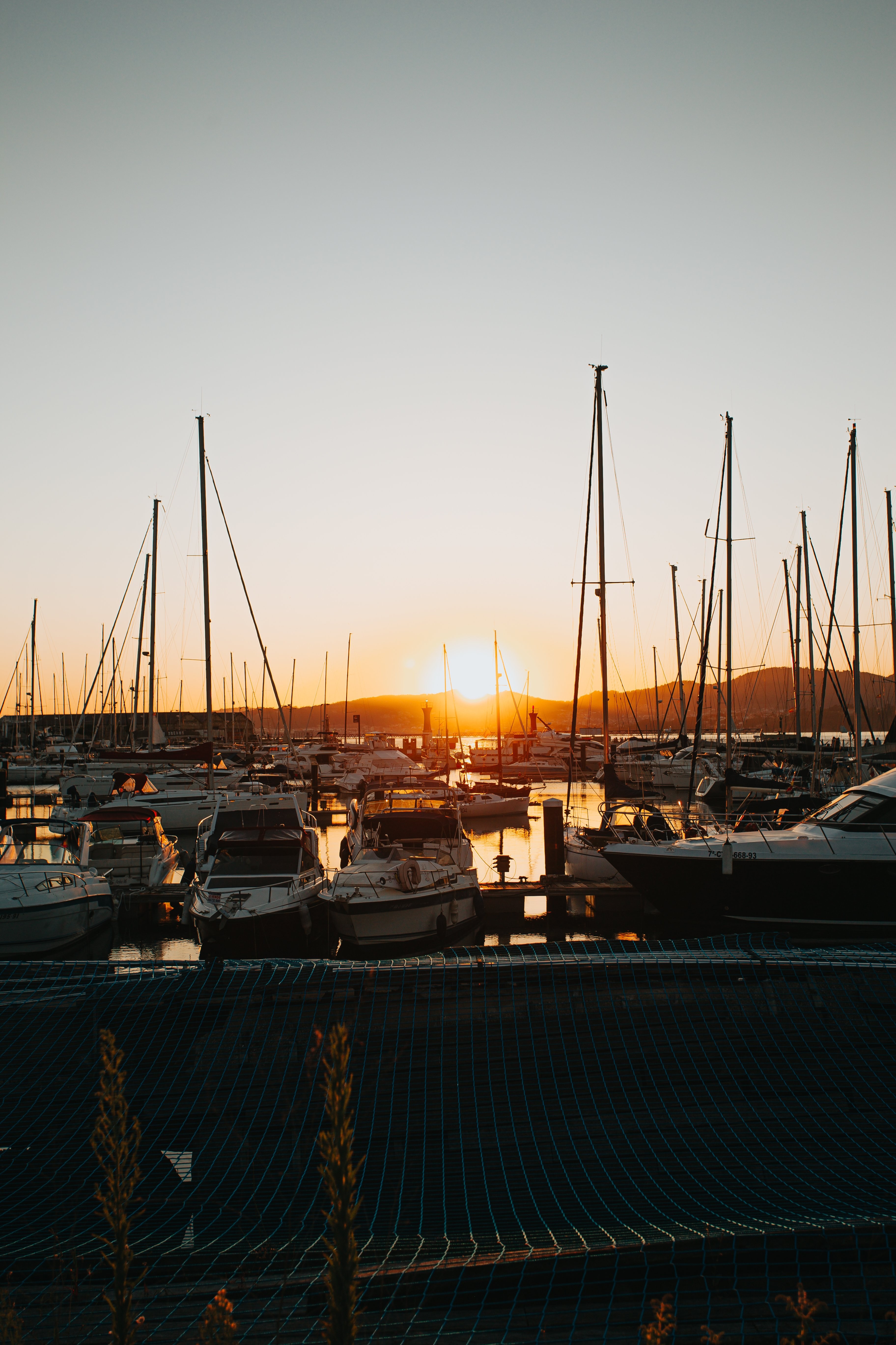 Stunning Golden Sunset Over the Marina – Captivating Photo