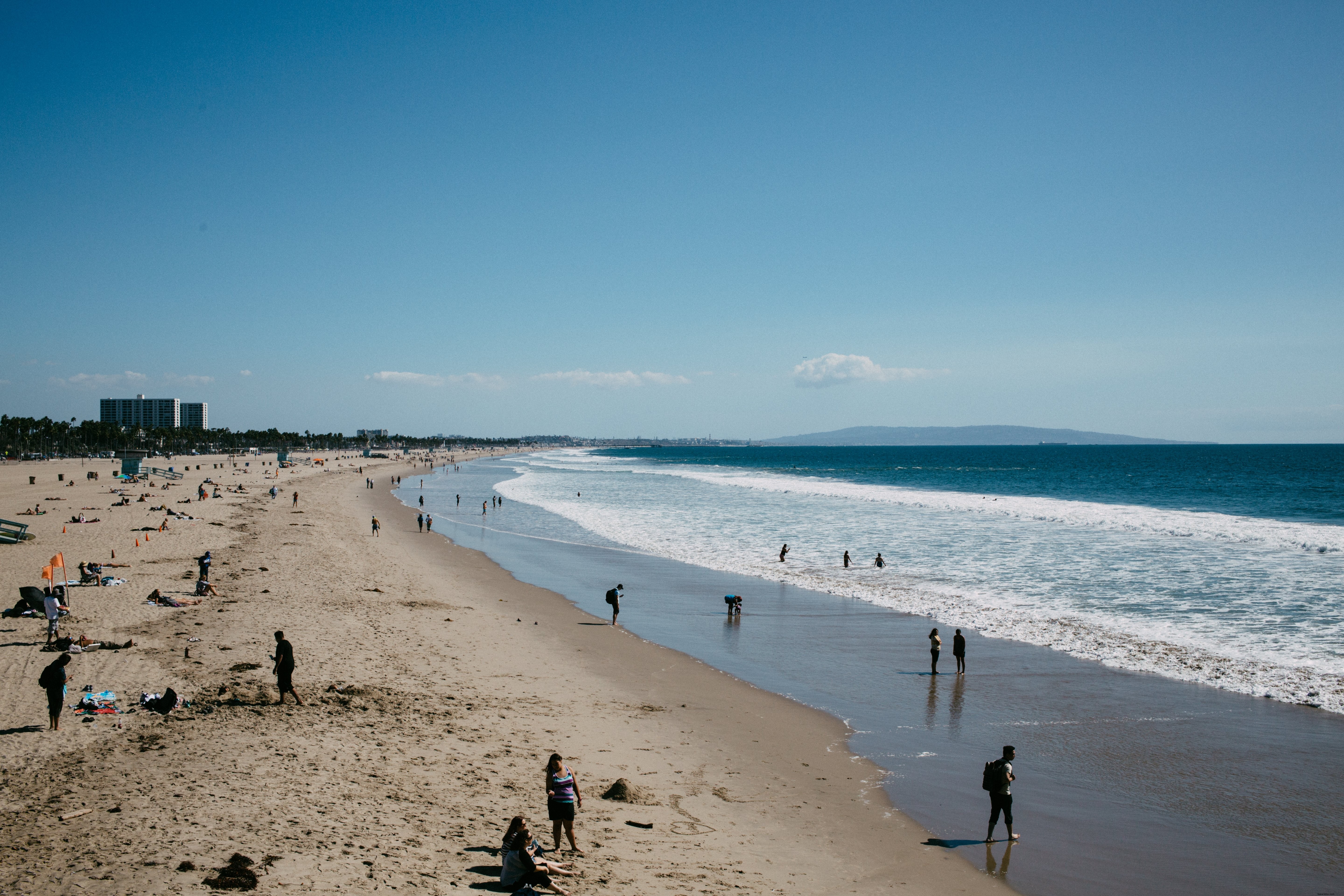 Vibrant Summer Beach Bliss: People Enjoying a Sunny Day by the Sea