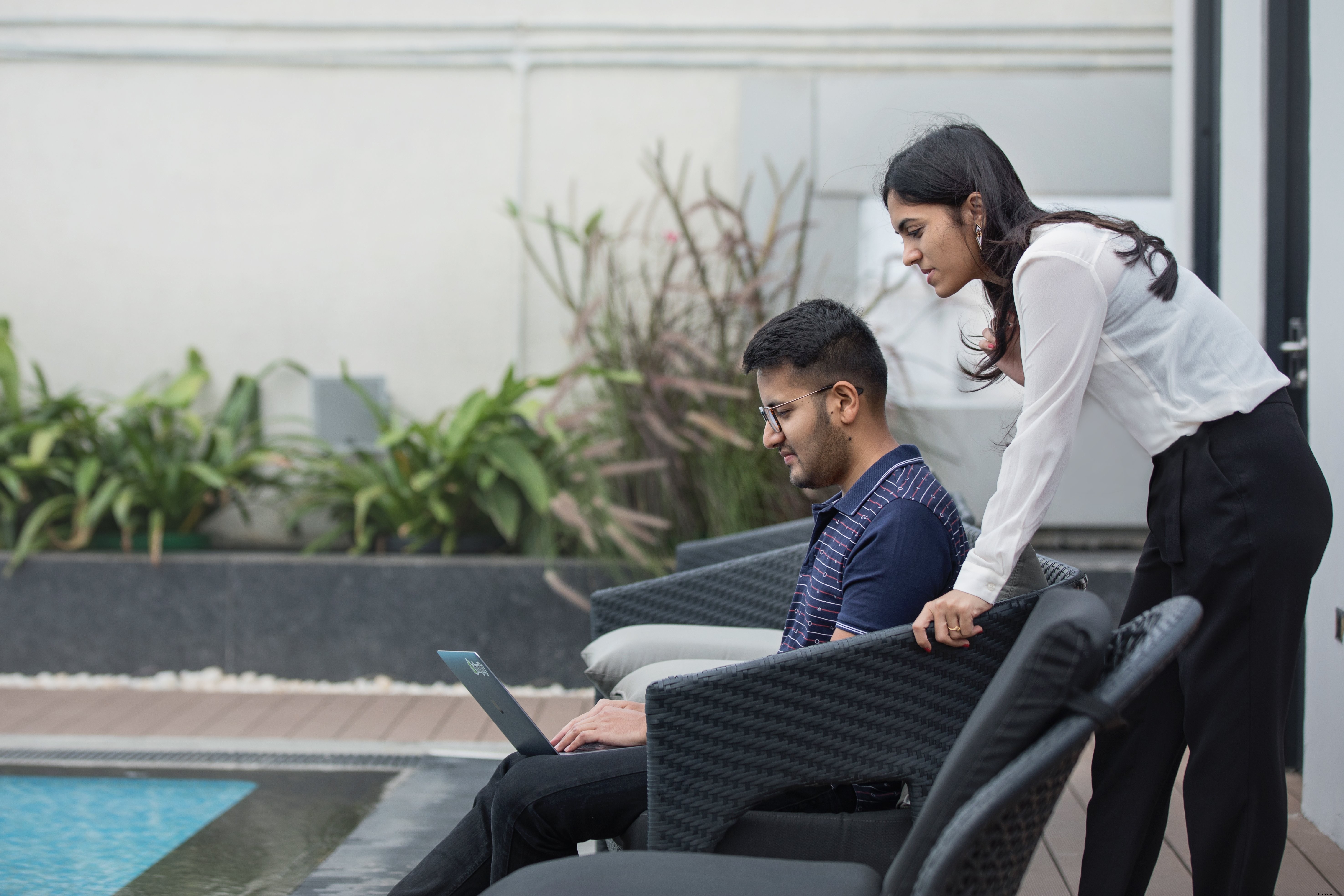 High-Quality Photo: Man and Woman Collaborating Outdoors