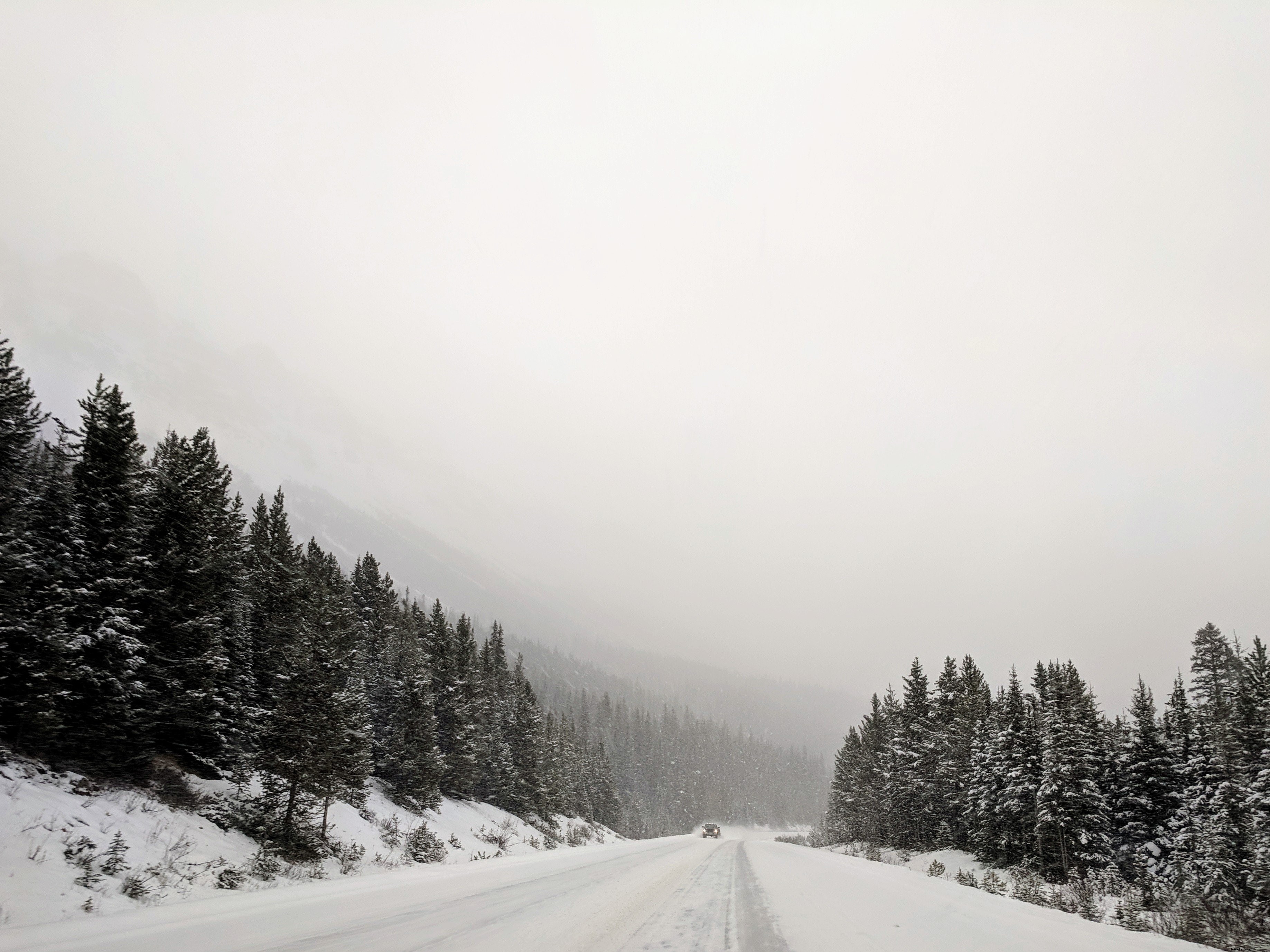 Stunning Photo: Lone Truck on a Snowy Road