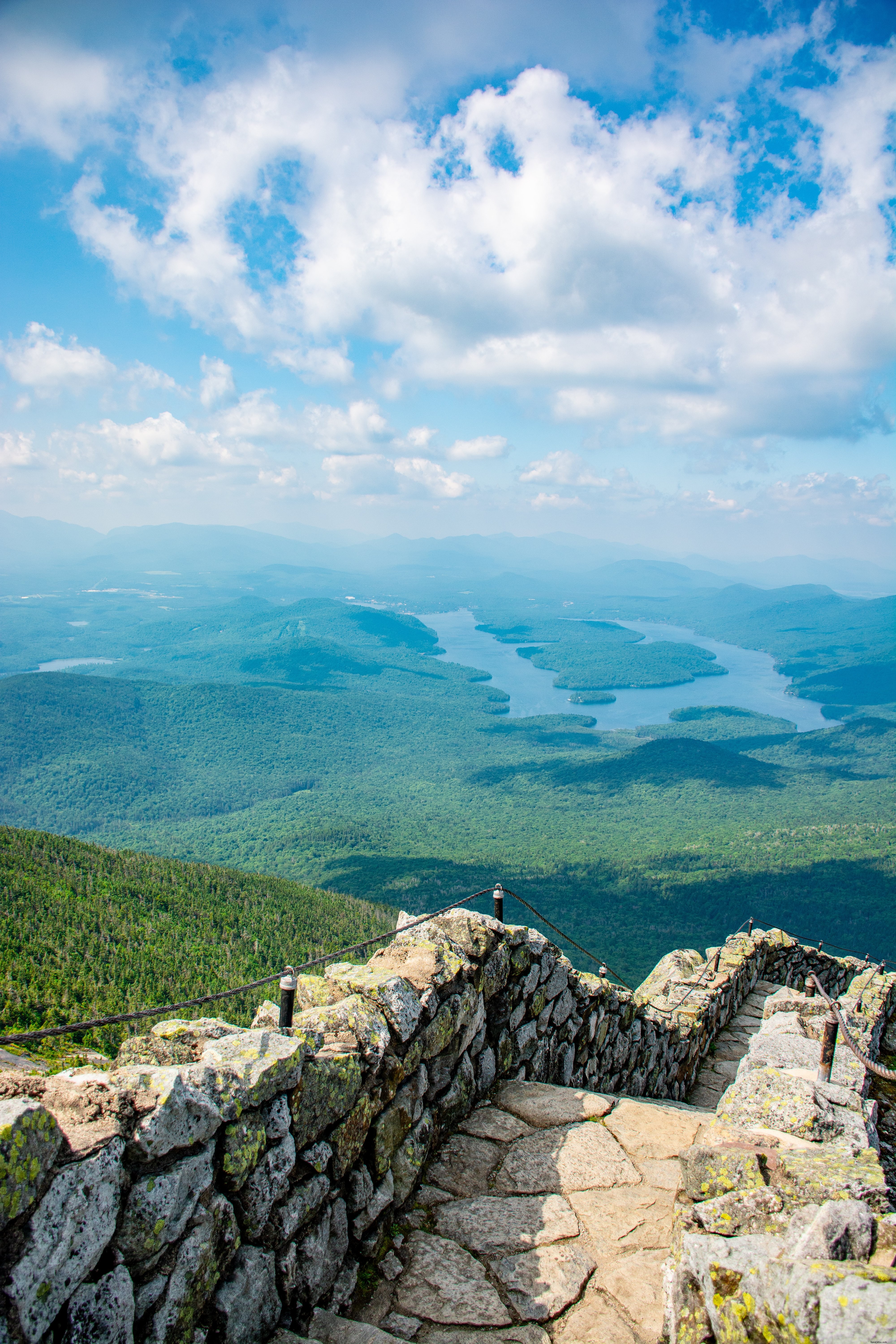 Stunning Paved Stone Path Descending into Lush Green Valley Photo
