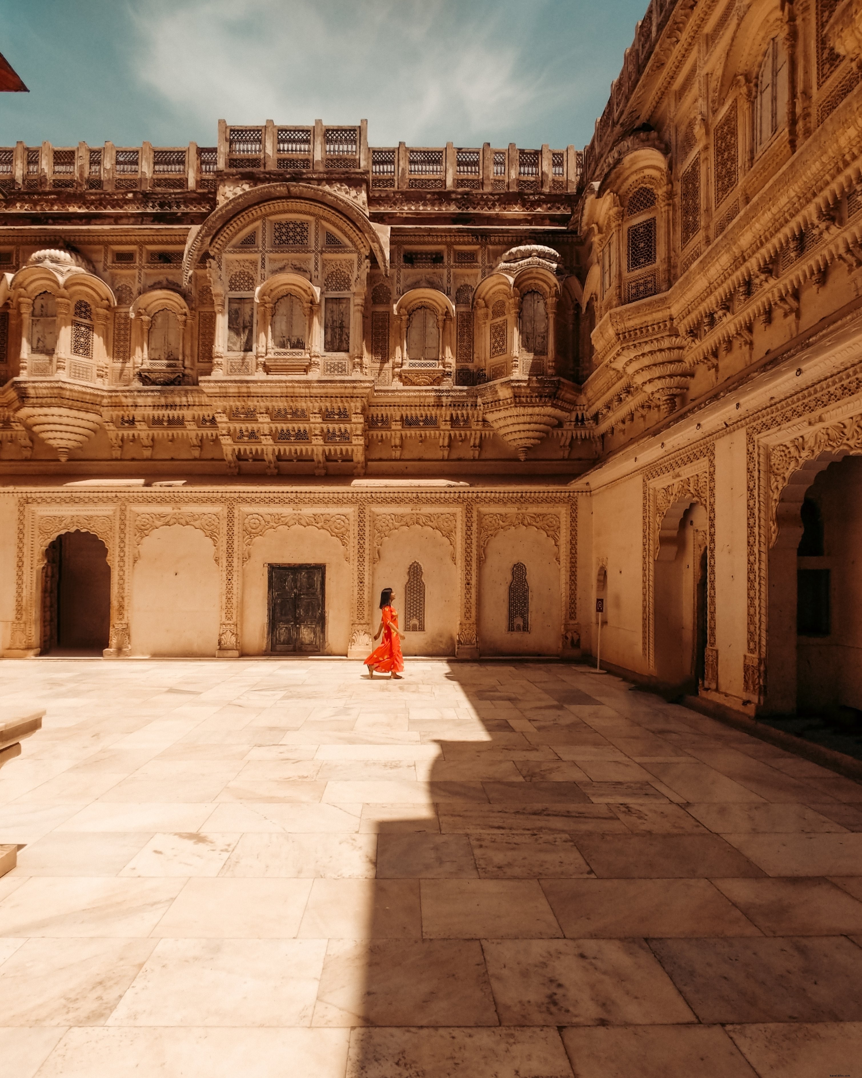 Elegant Woman in Serene Courtyard: Stunning High-Resolution Photo
