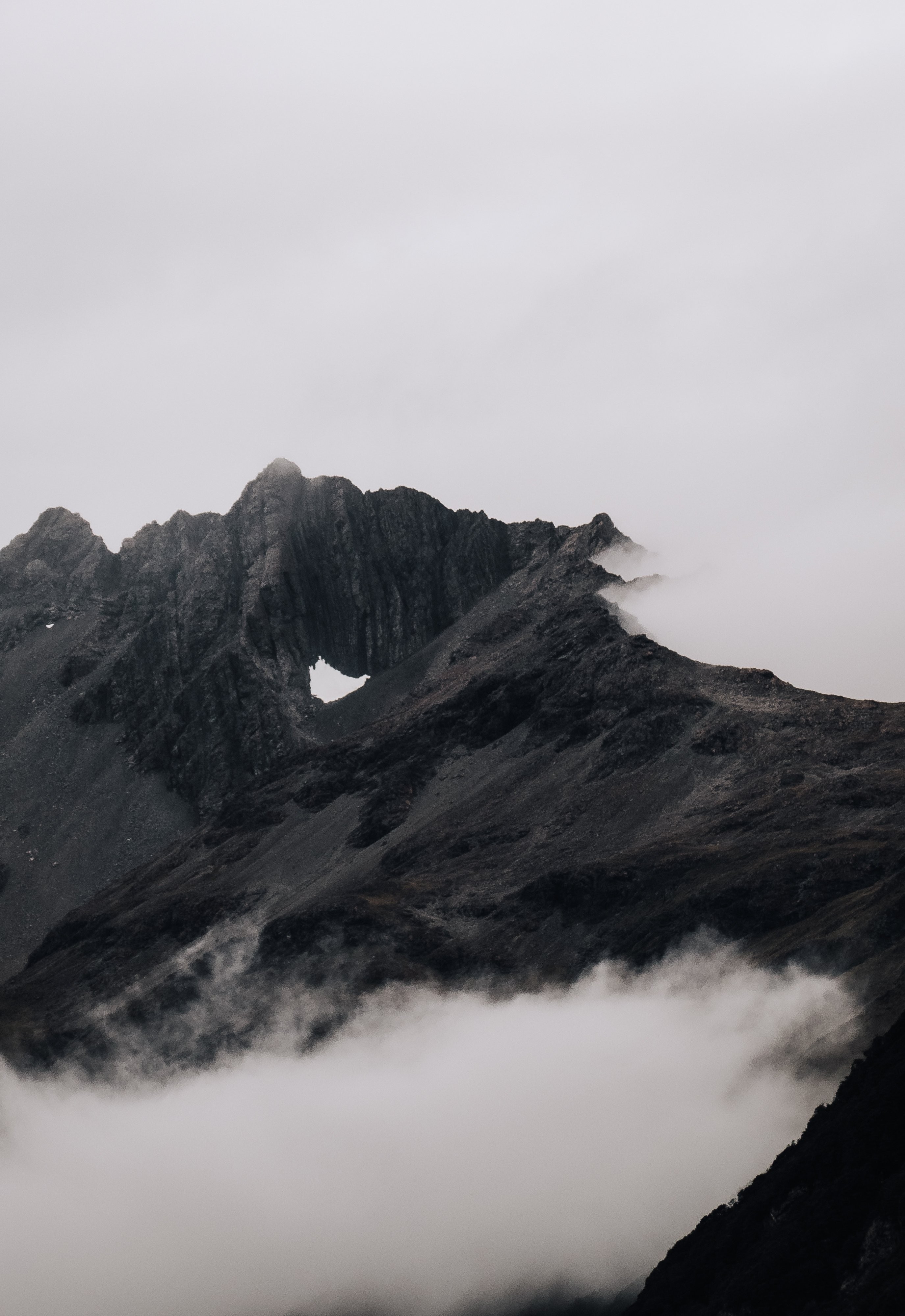 Breathtaking Dark Misty Mountain Summit Photo