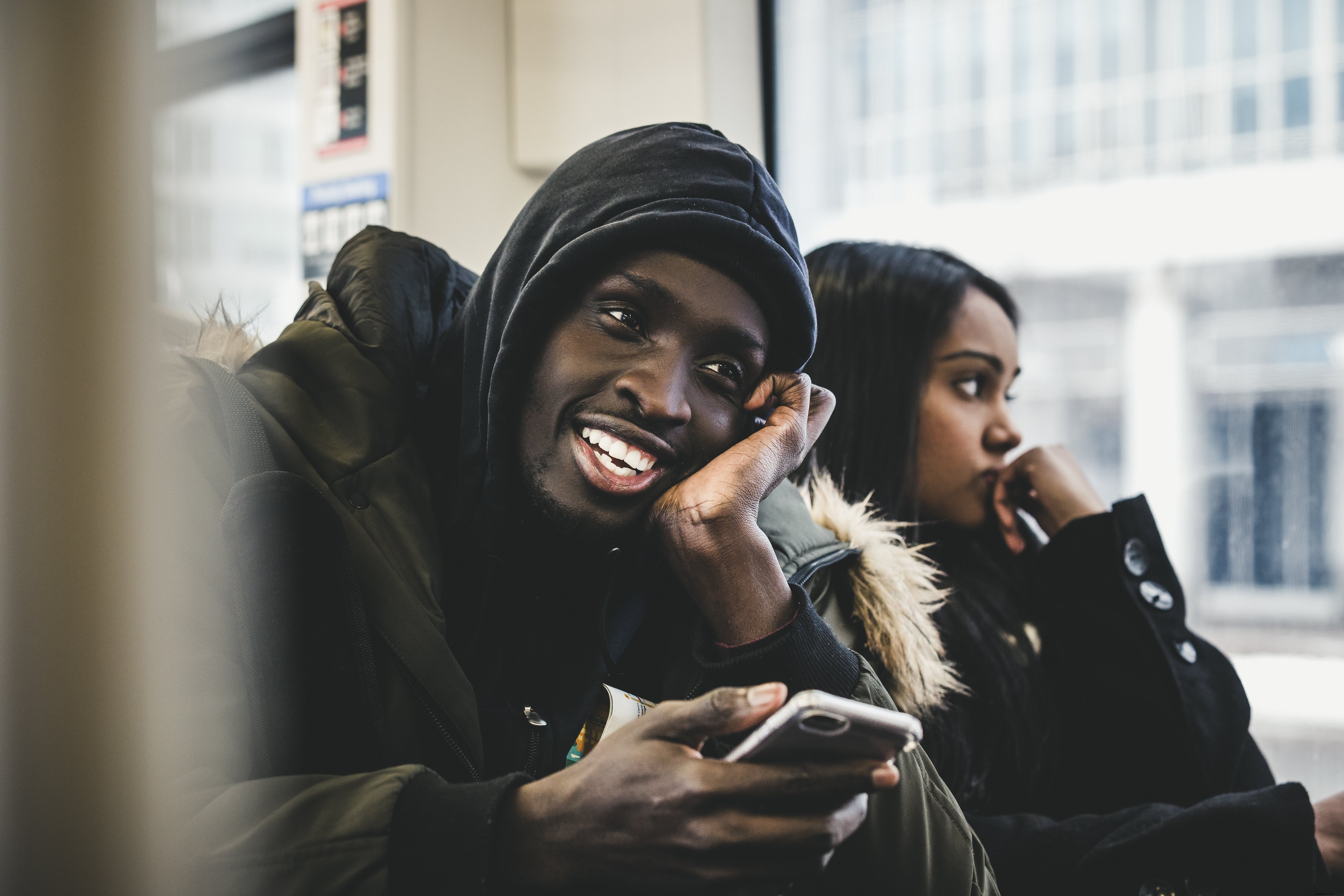 Candid Shot: Joyful Man Smiling on a Public Bus