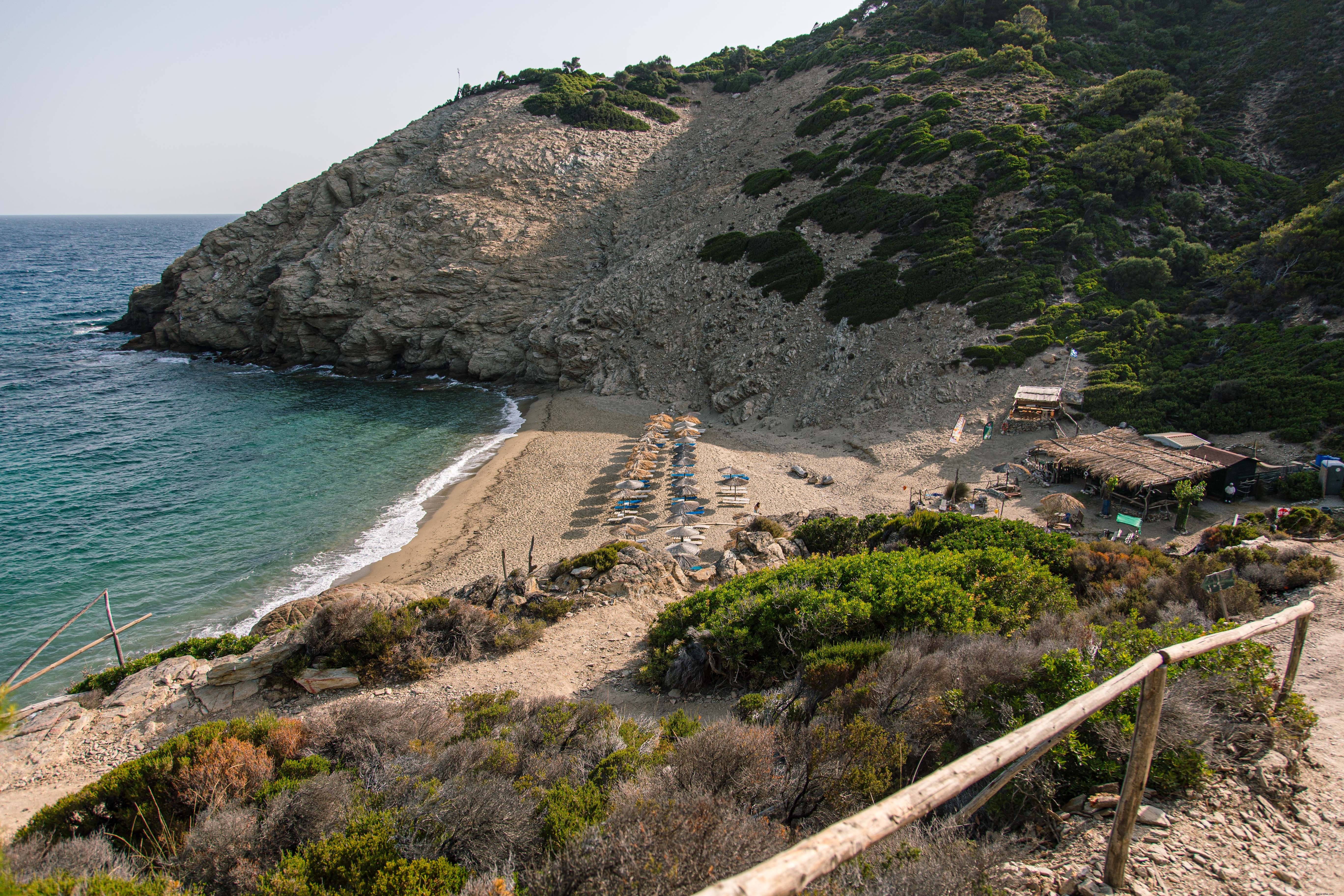 Stunning Straw Parasols on a Picturesque Beach in Greece – Scenic Photo