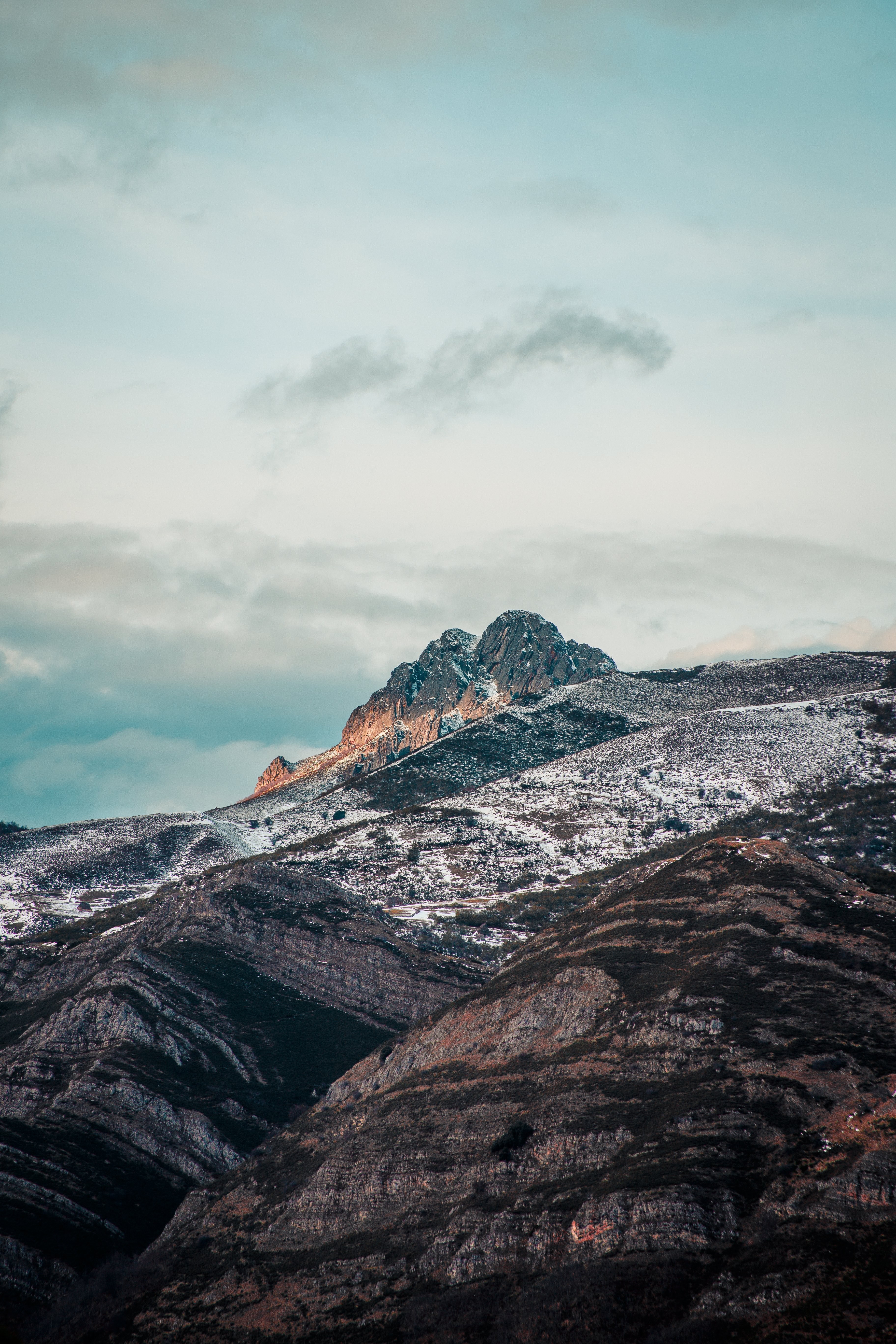 Stunning Blue Cloudy Sky Over Majestic Snowy Mountains – Captivating Photo