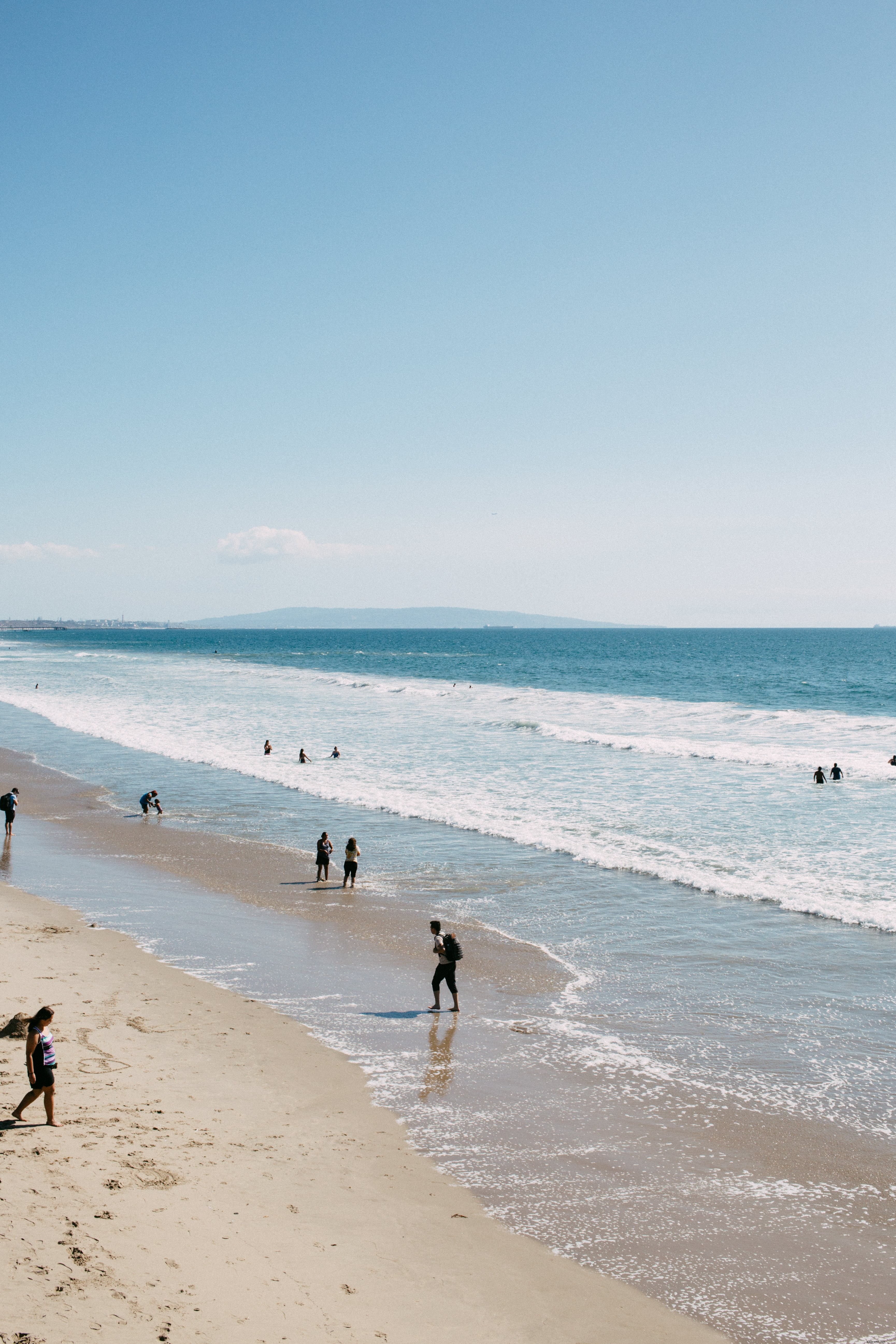 Stunning Portrait of a Sunny Beach Day: Vibrant Ocean Serenity