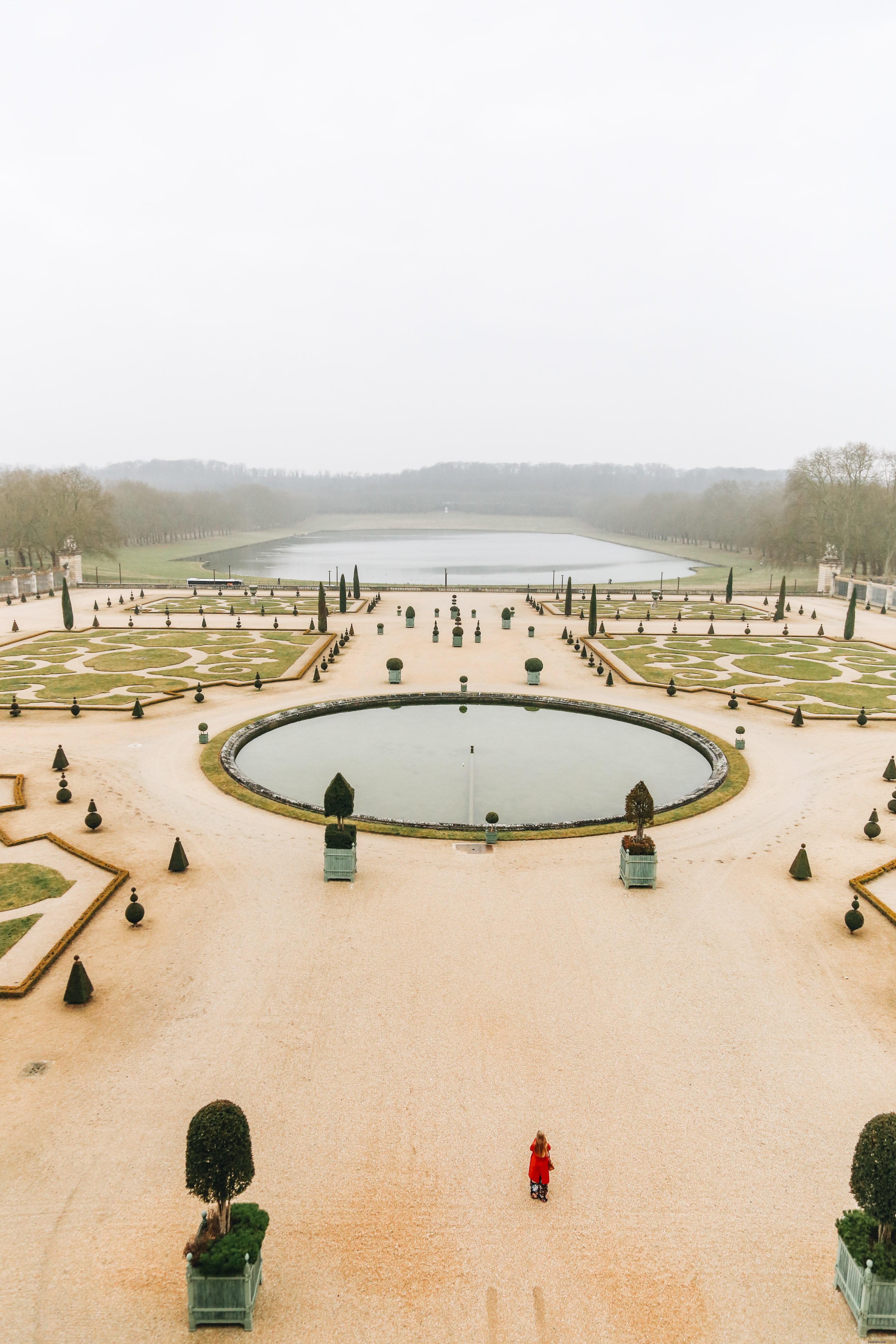 Elegant Woman in the Majestic Gardens of Versailles – Stunning Photography