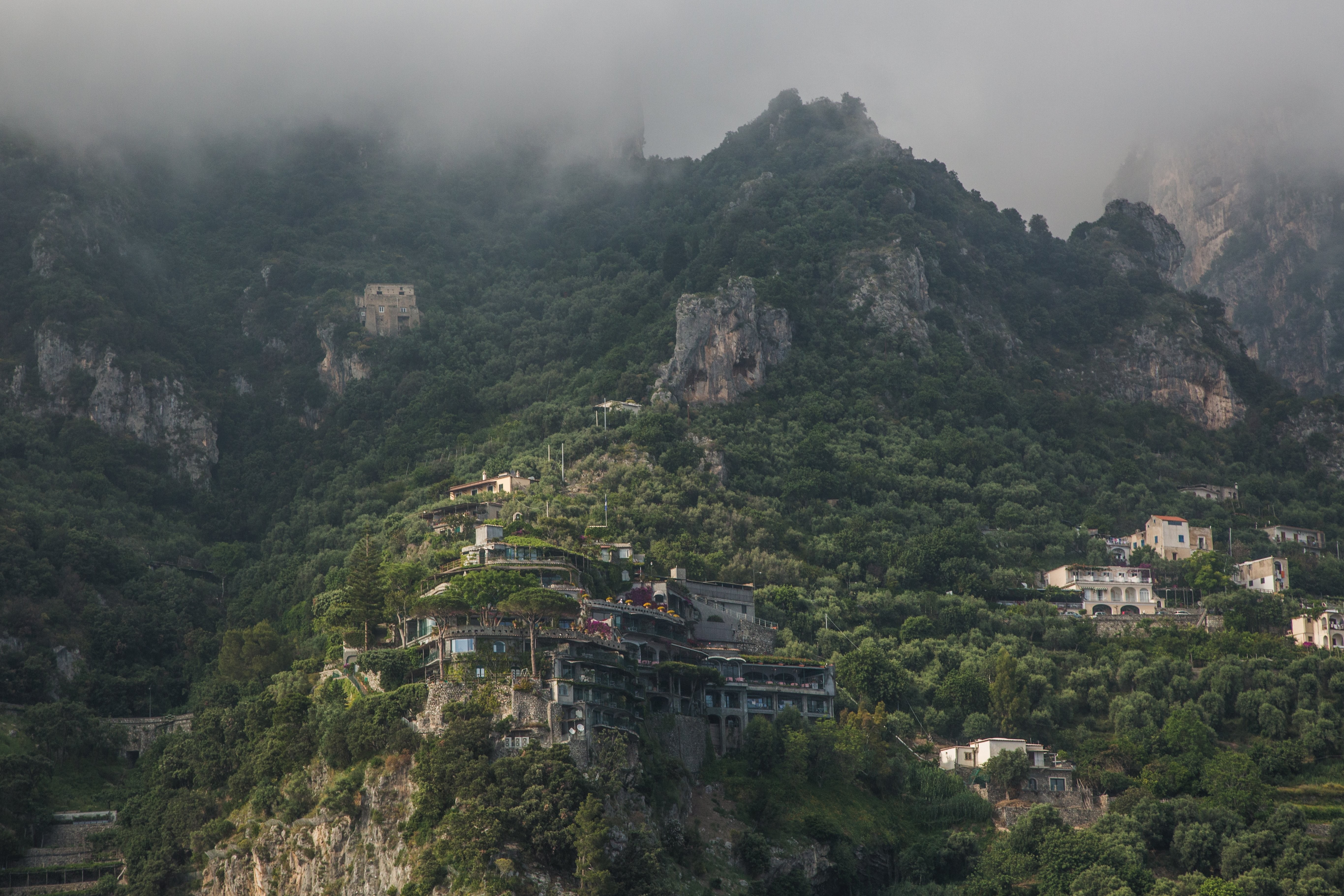 Breathtaking Misty Mountains Landscape with Majestic Buildings Photo