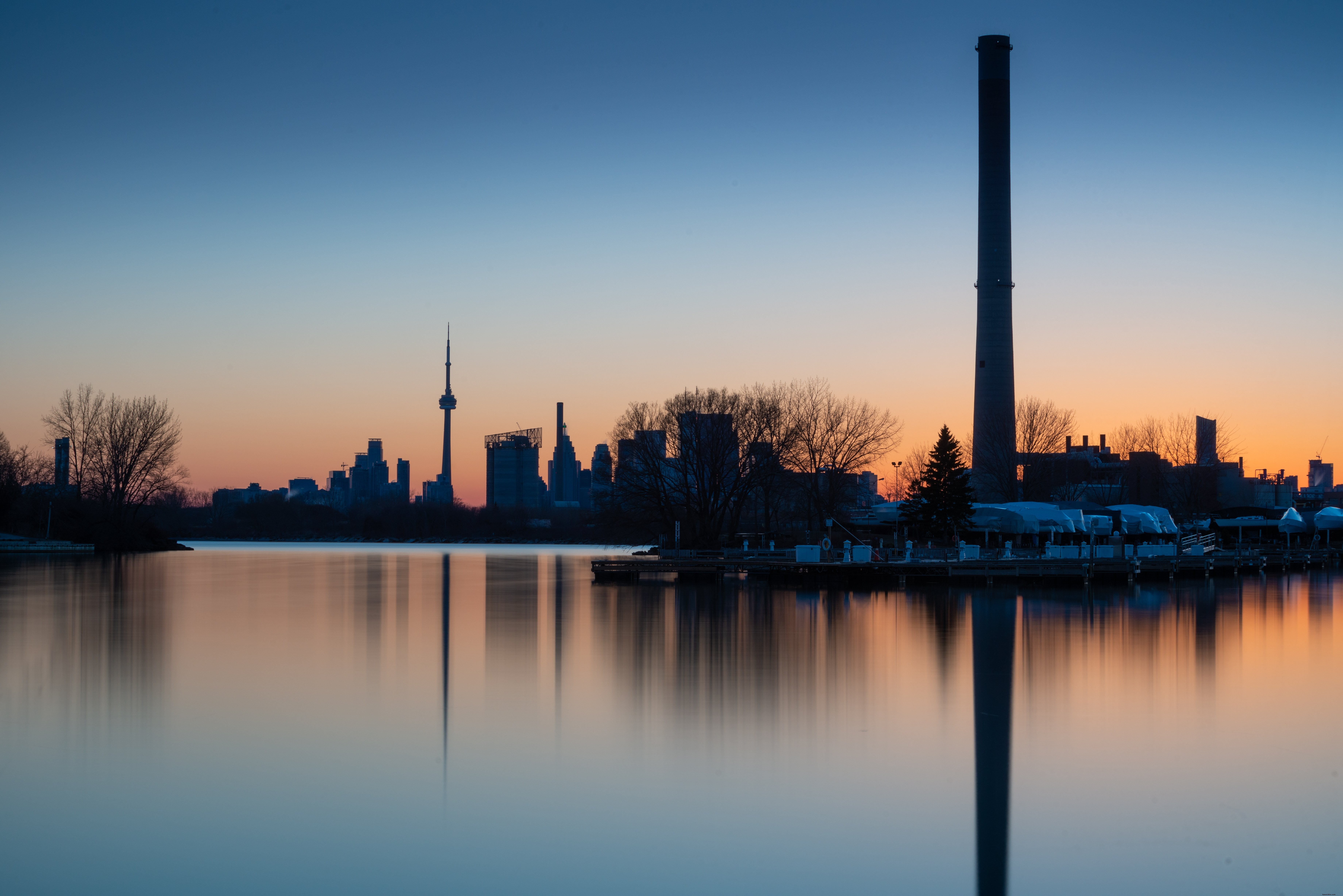Stunning Toronto Skyline at Sunset Reflecting on the Waterfront – Captivating Photo