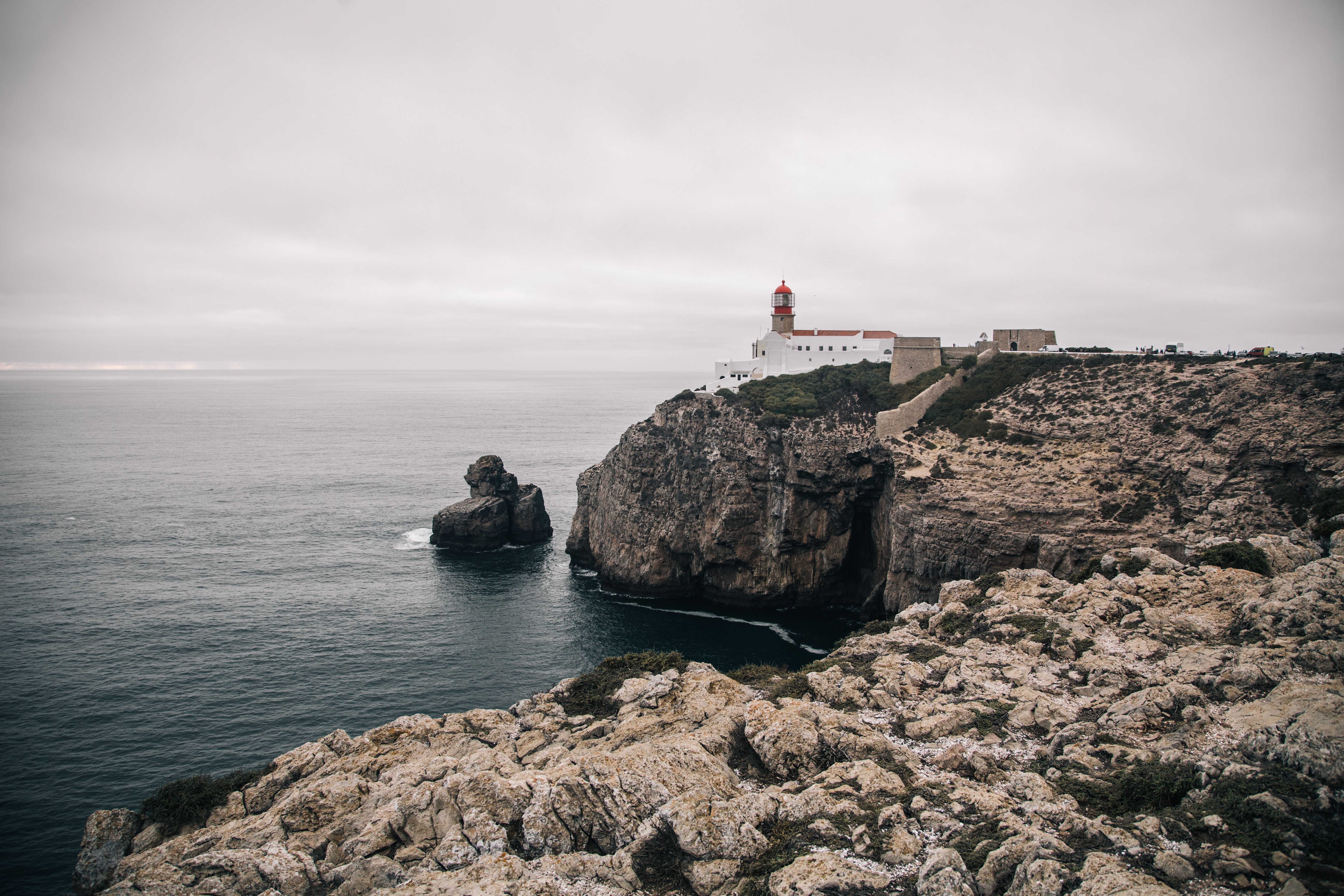 Stunning Whitewashed Lighthouse Perched on a Rugged Craggy Cliff