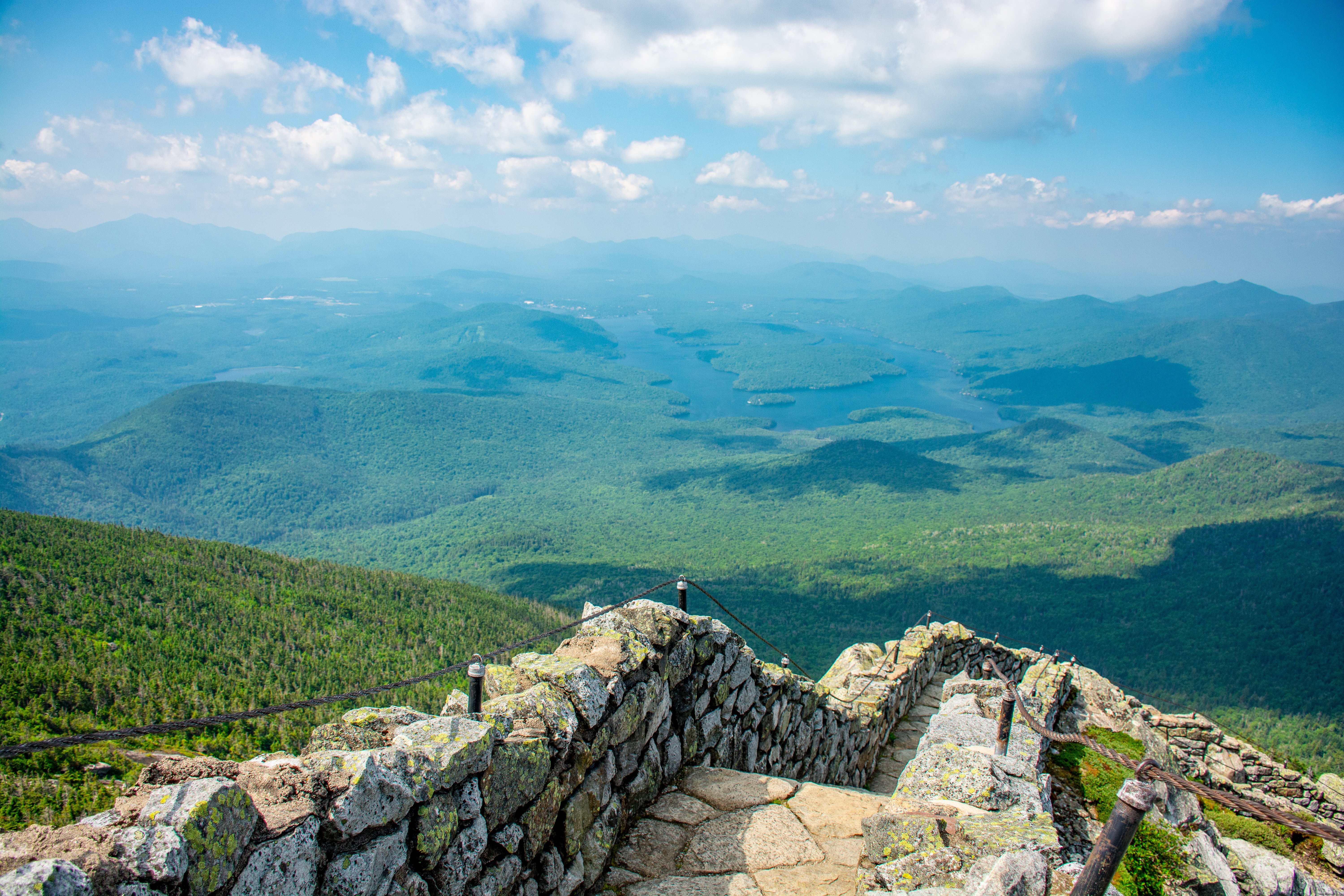 Stunning Landscape: Stony Path Descending to Lush Green Valley