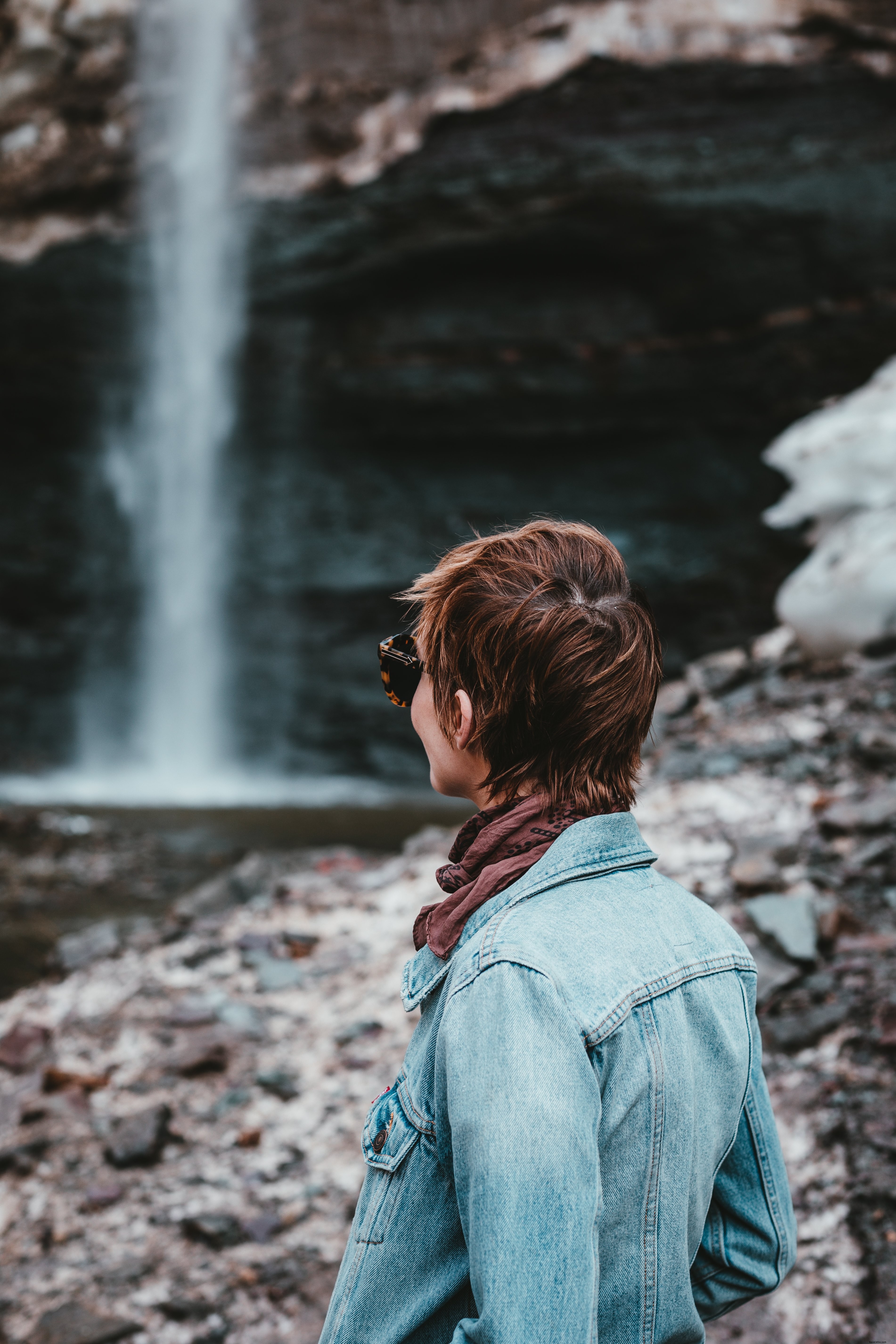 Captivating Photo: Young Woman Gazing at Breathtaking Scenic Landscape