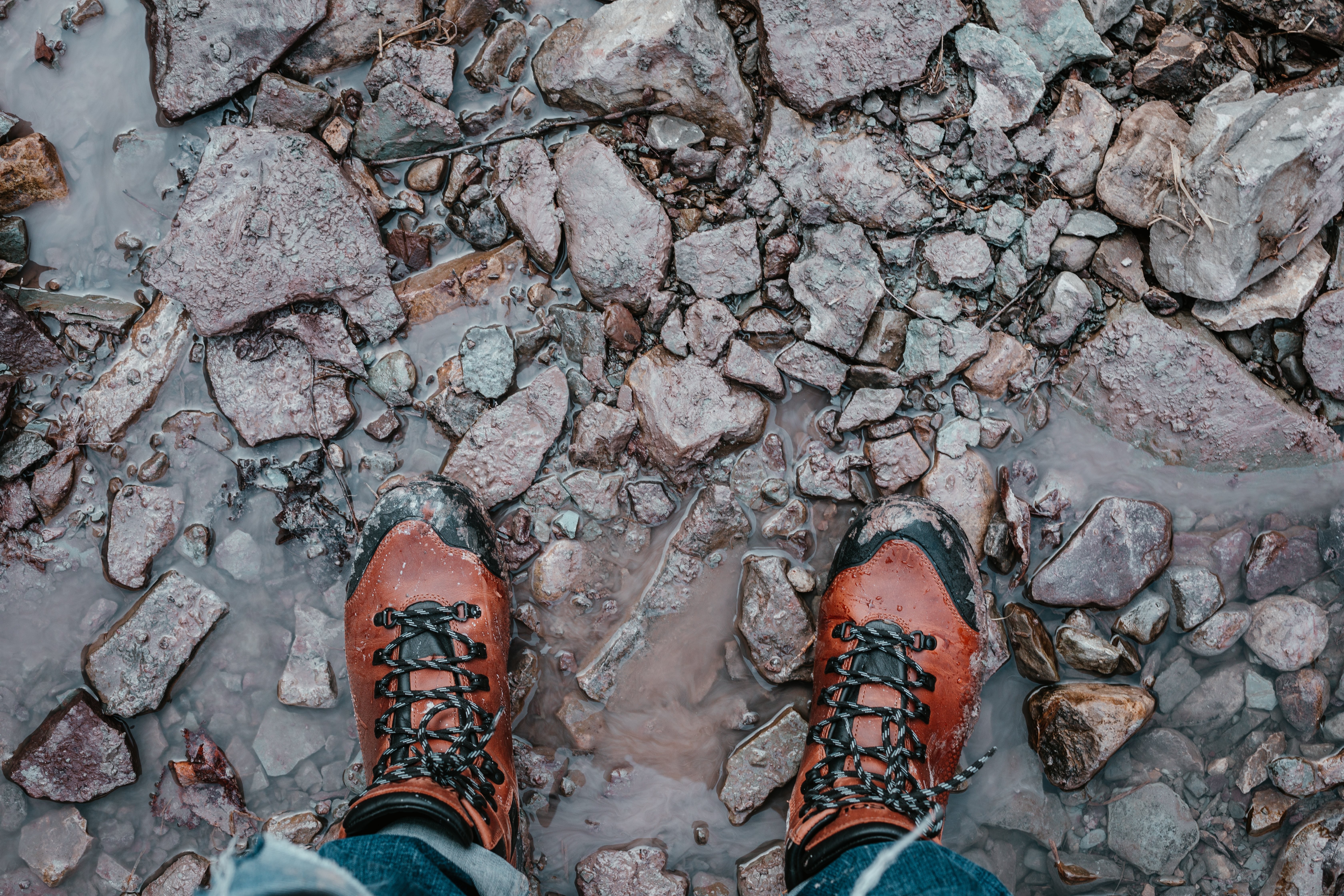 Rugged Hiking Boots on Jagged Rocks: Stunning Outdoor Adventure Photo