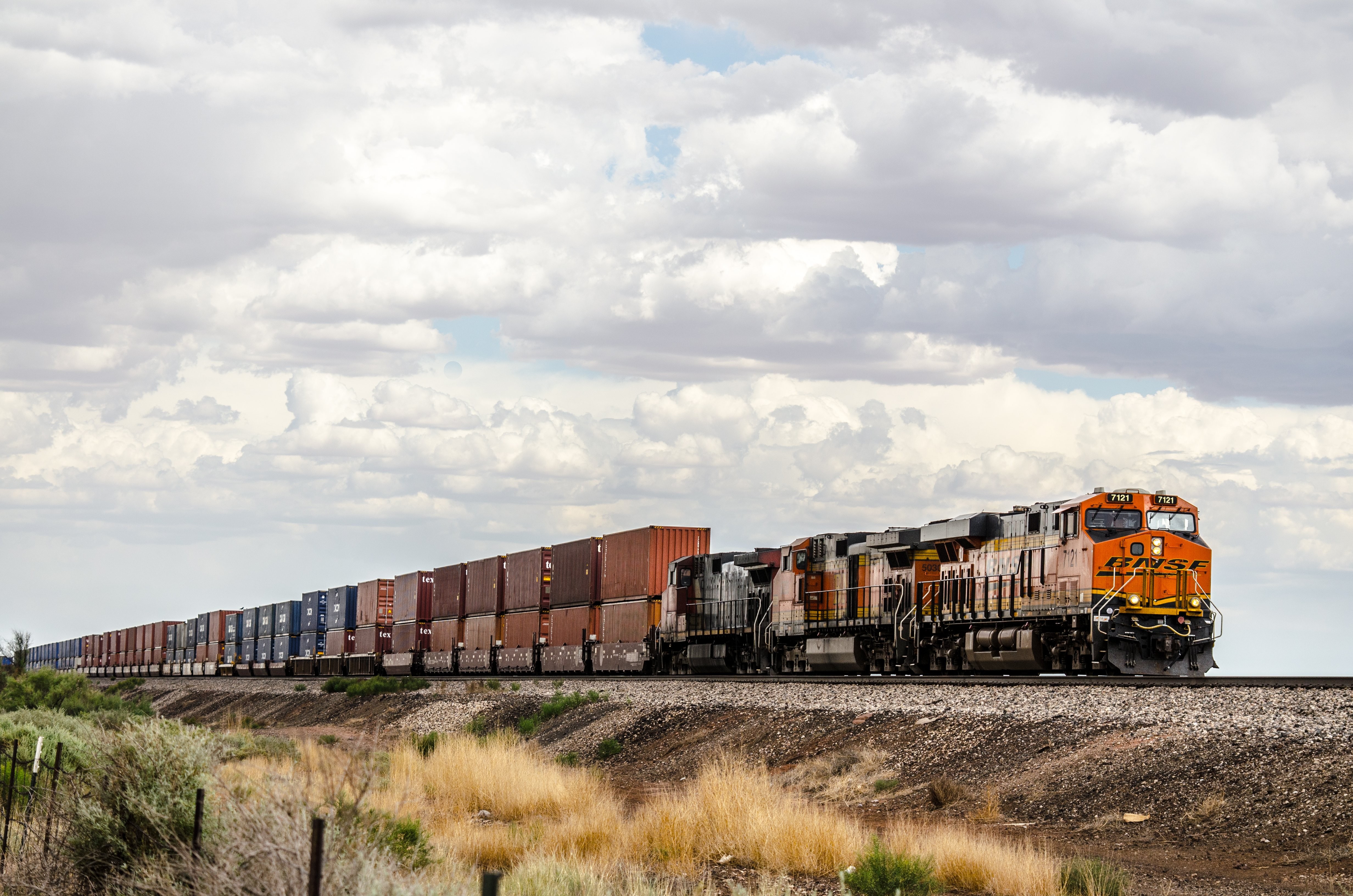 Stunning Photo: Freight Train Hauling Containers Across Vast Plains