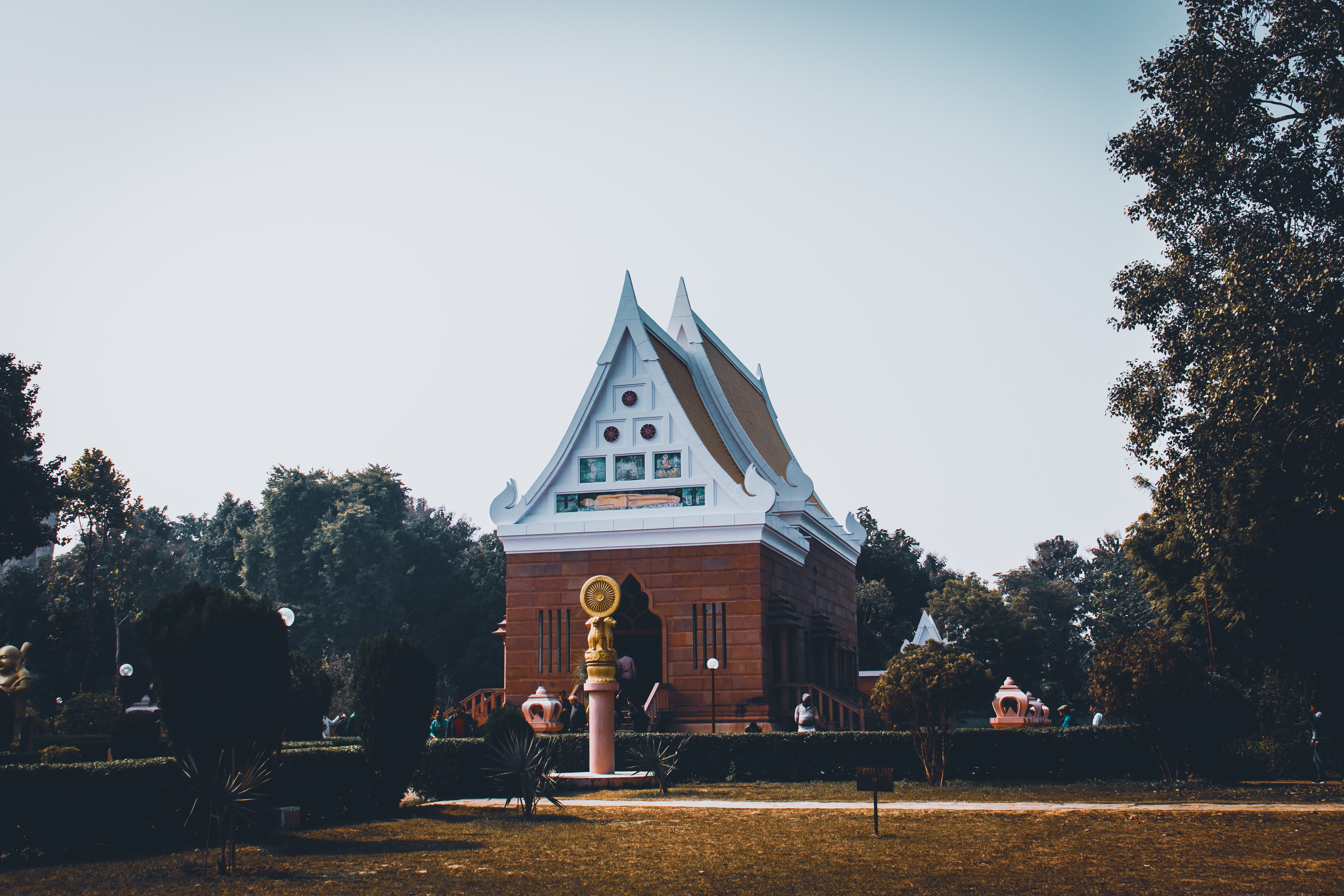 Serene Temple Nestled Among Lush Trees – Stunning High-Res Photo