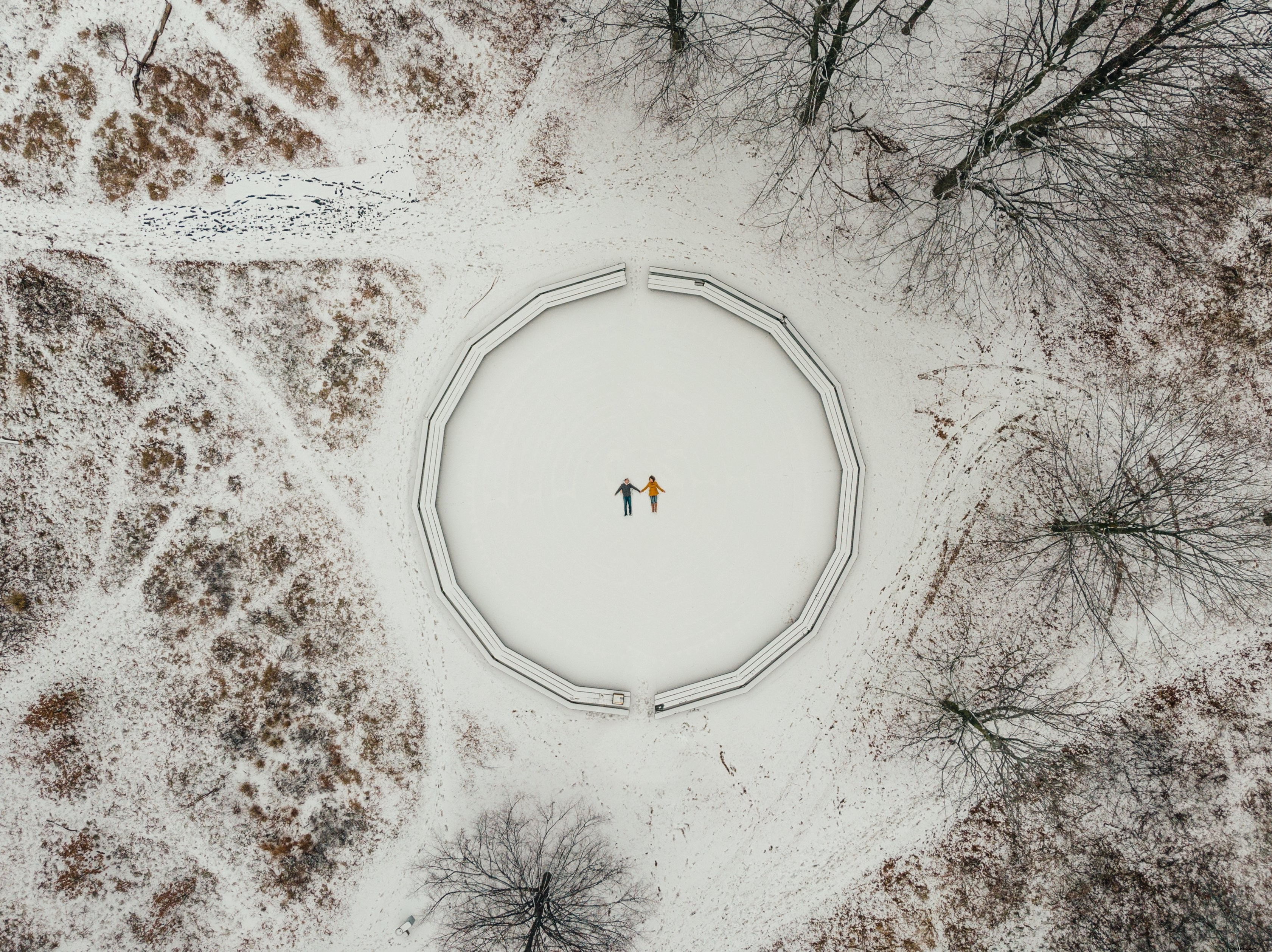 Stunning Aerial View of Two Snow Angels Amidst Snowy Trees