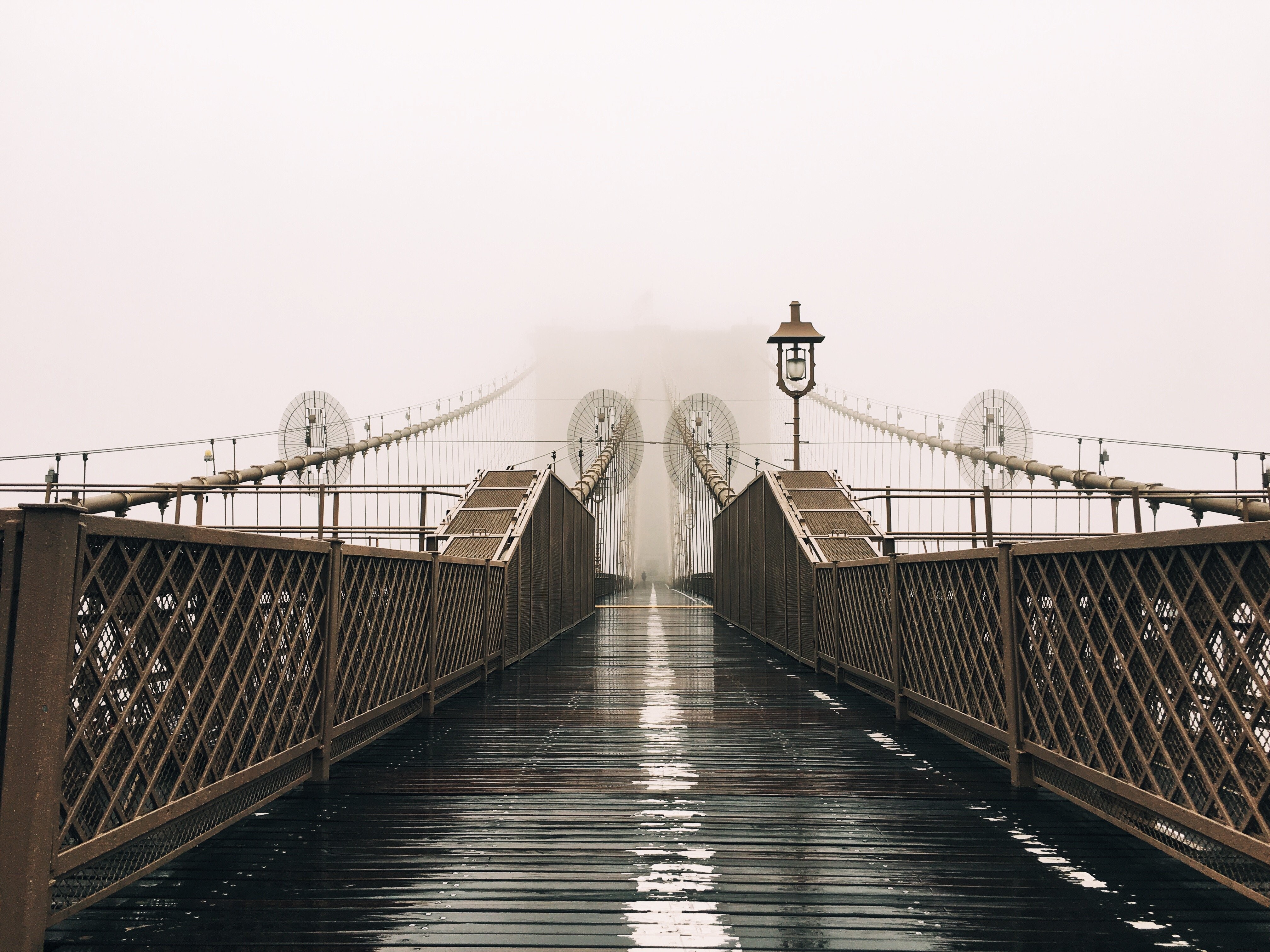 Stunning Fog-Shrouded Wet Bridge: Captivating Atmospheric Photo