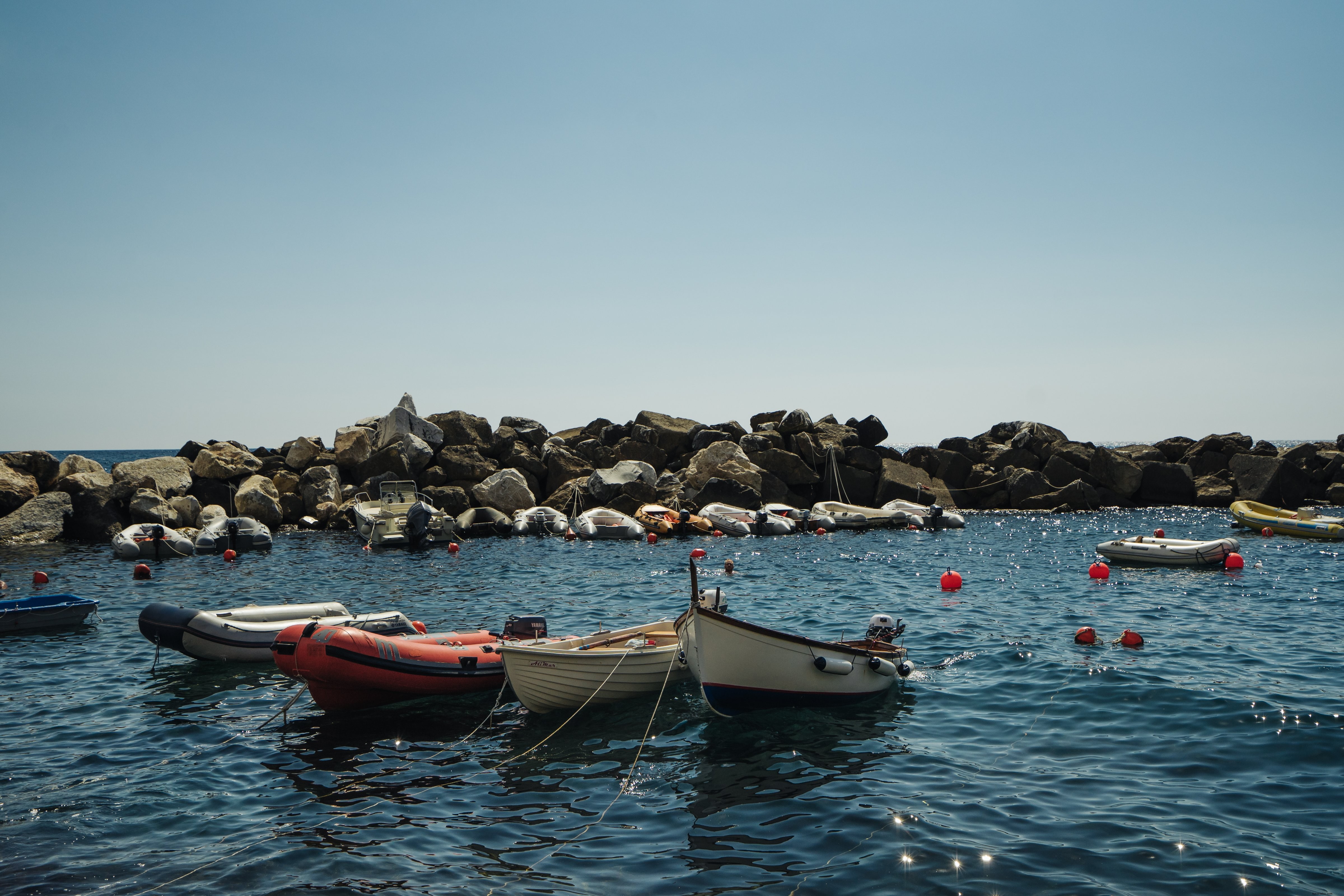 Serene Boats in a Picturesque Rocky Cove: Stunning Coastal Photo