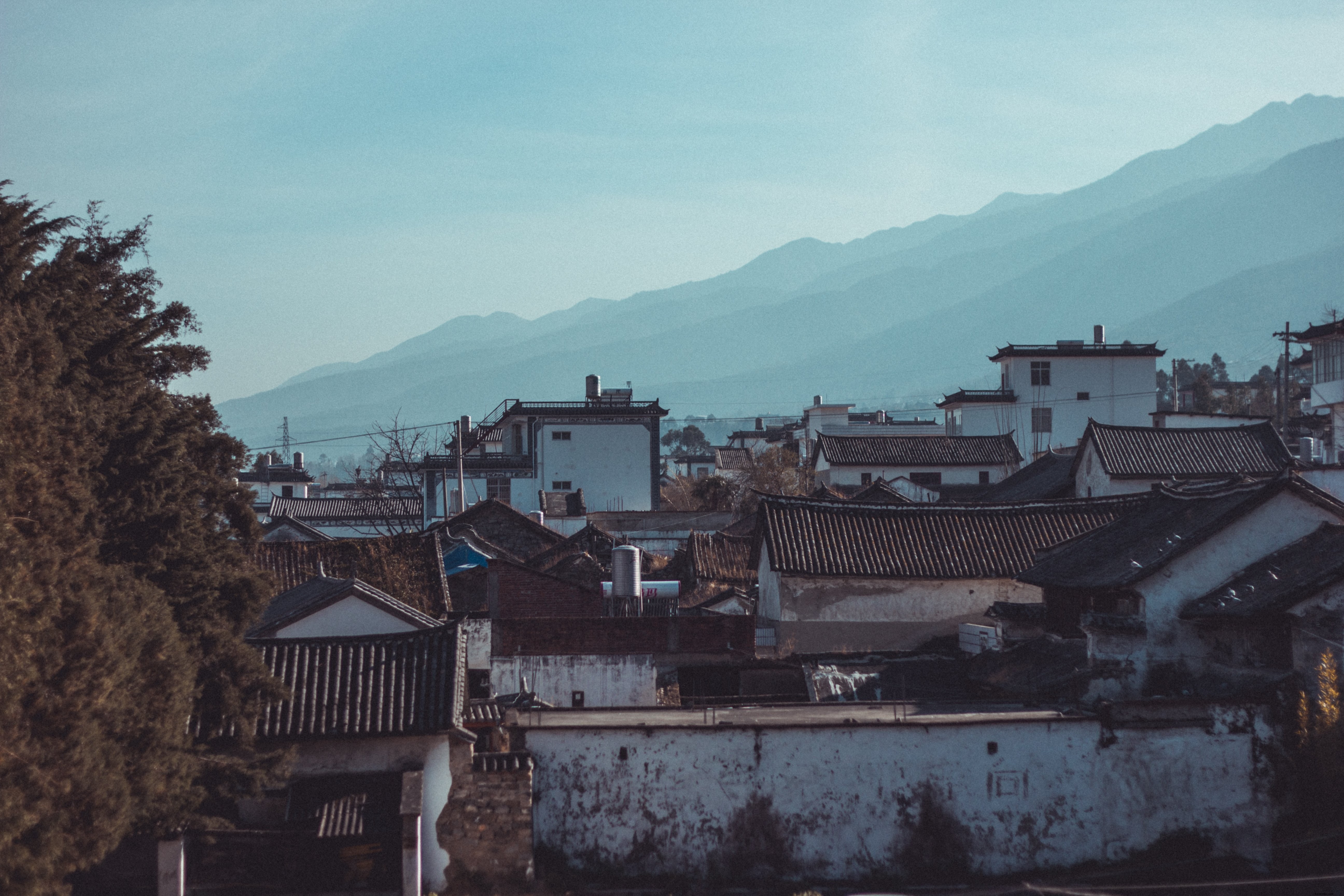 Stunning Photo of Picturesque Chinese Village Nestled Beneath Hillsides