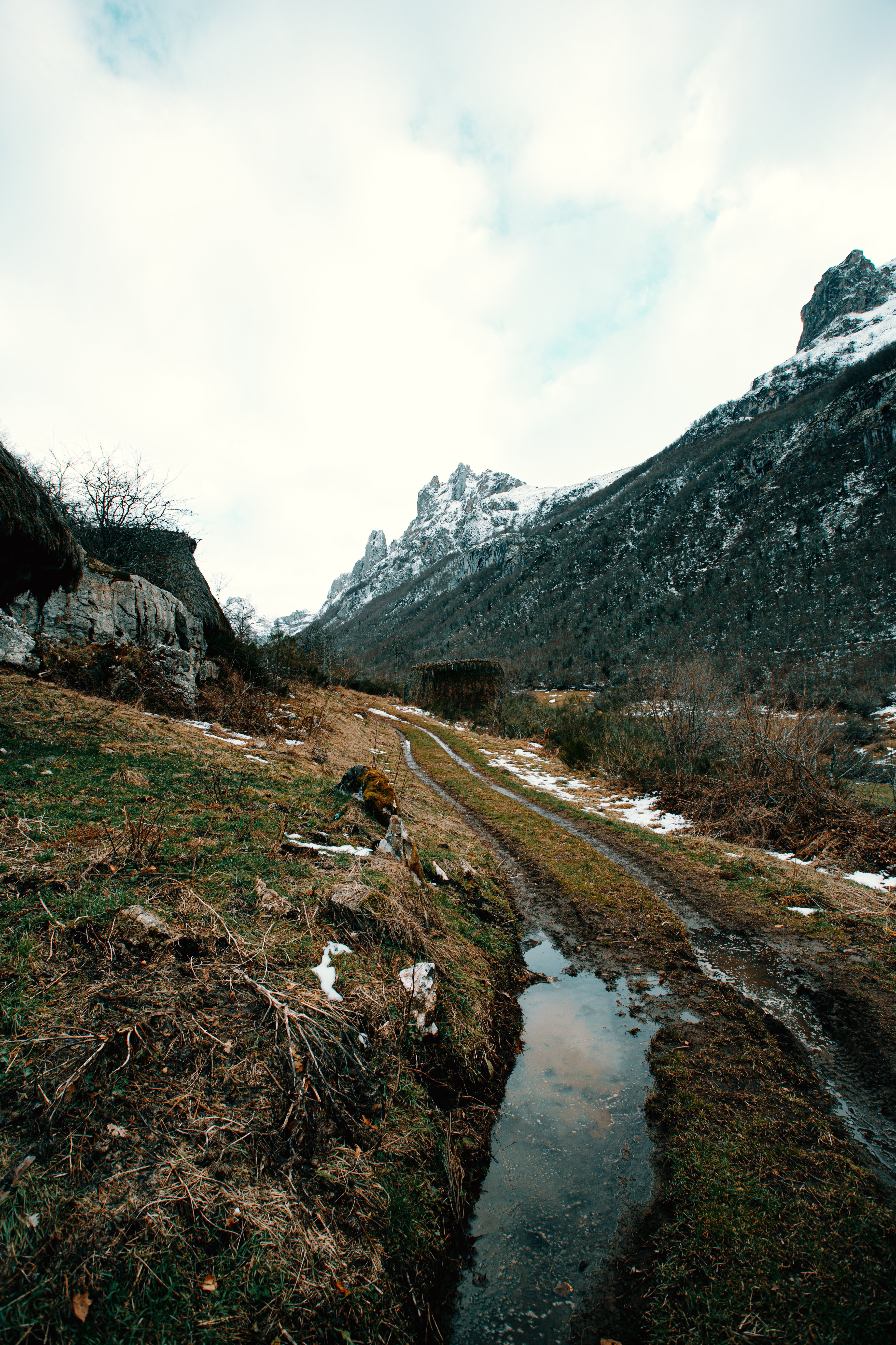 Dramatic Tire Tracks Winding Along a Rugged Mountainside – Stunning Landscape Photo