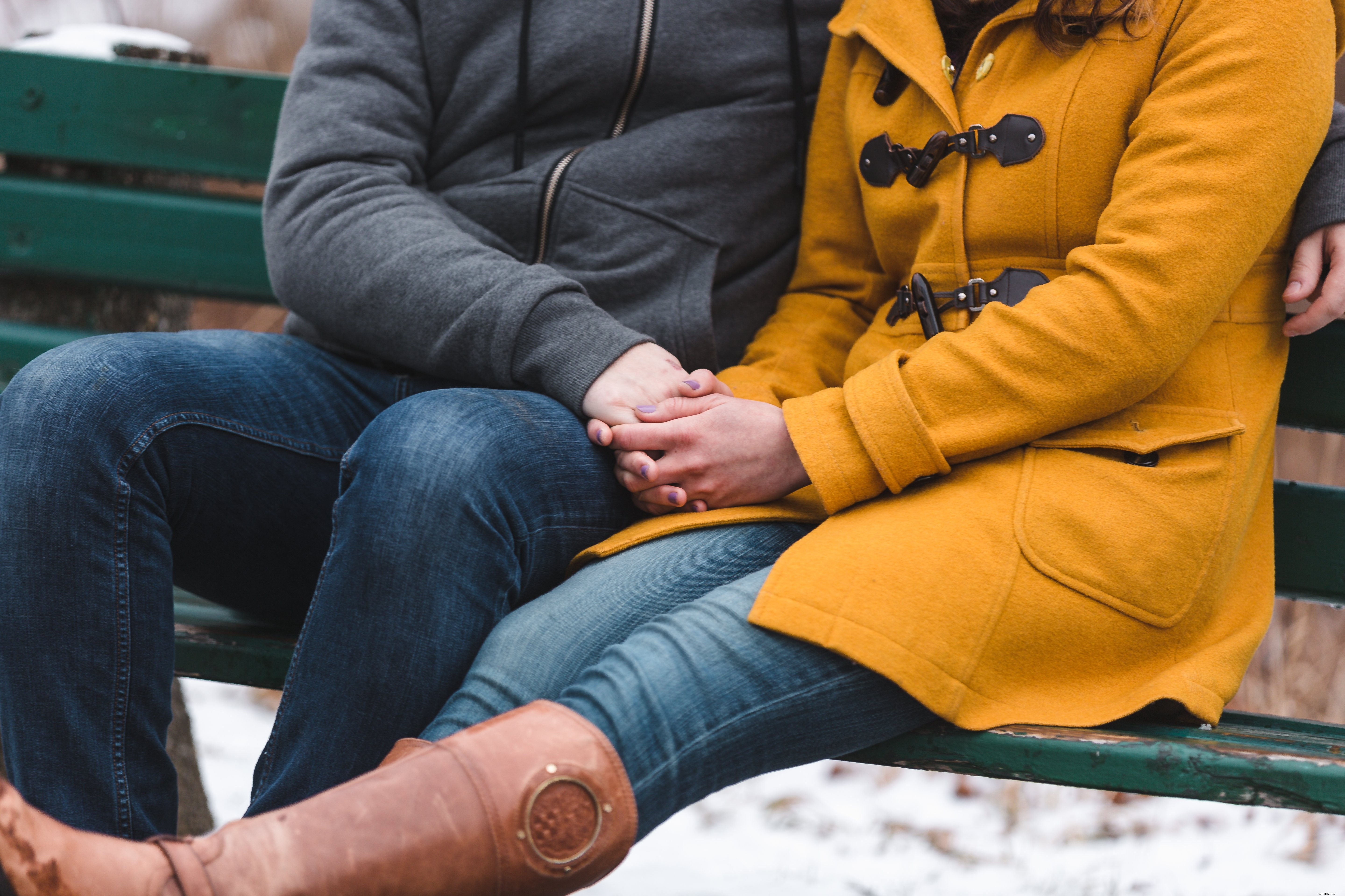 Heartwarming Photo: Couple Huddling for Warmth on a Bench