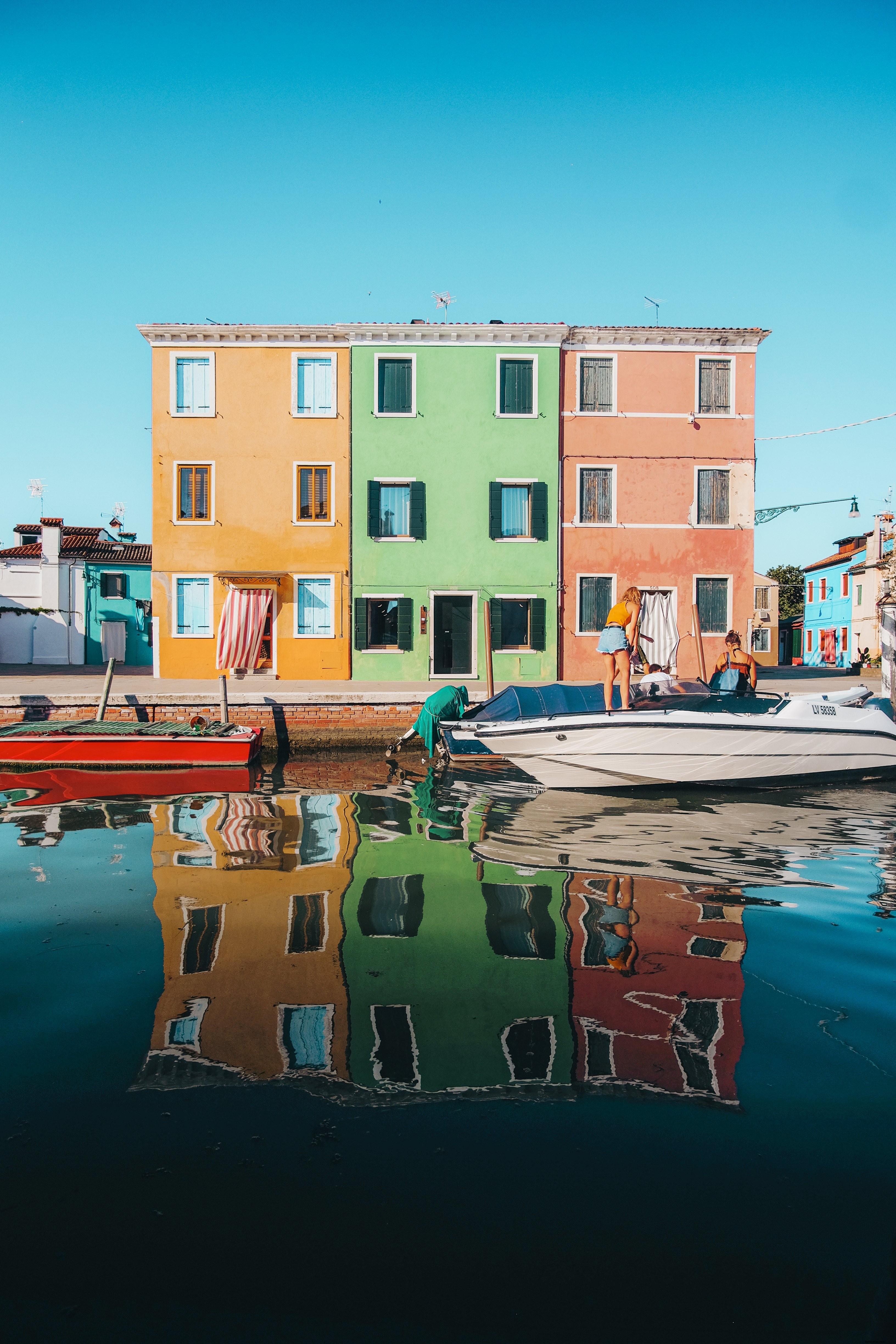 Stunning Photo of Three Vibrant Matching Buildings in Yellow, Green, and Red